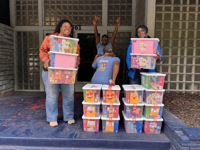 Voltava and their family loading totes along side the C.O.L.E. Foundation being silly 