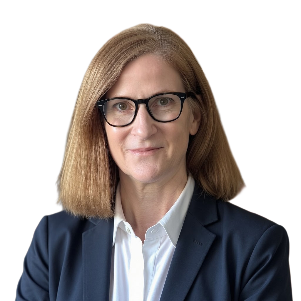 Professional woman with shoulder-length brown hair, wearing glasses, white shirt, and dark blazer, smiling subtly.