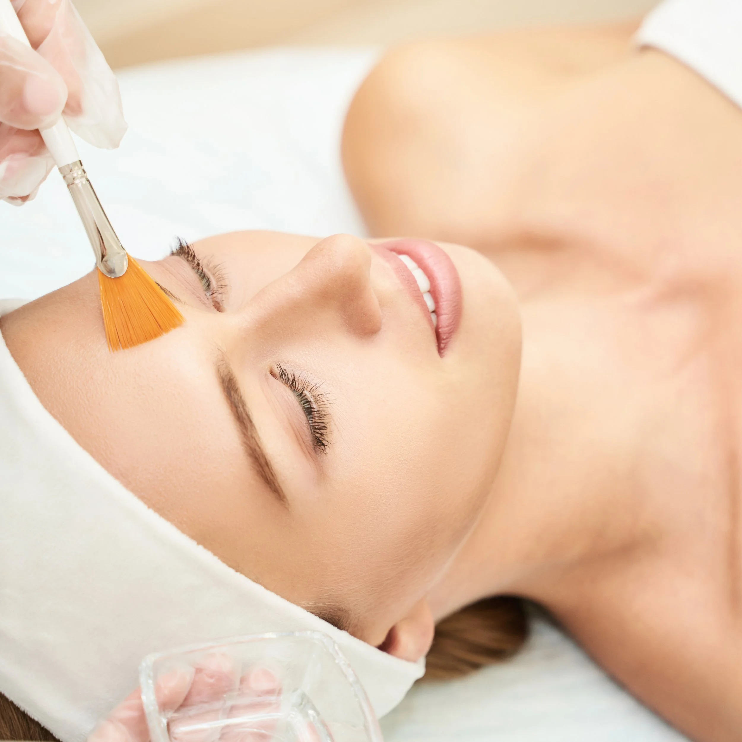 Woman receiving a facial chemical peel at a medical spa in San Clemente, CA.