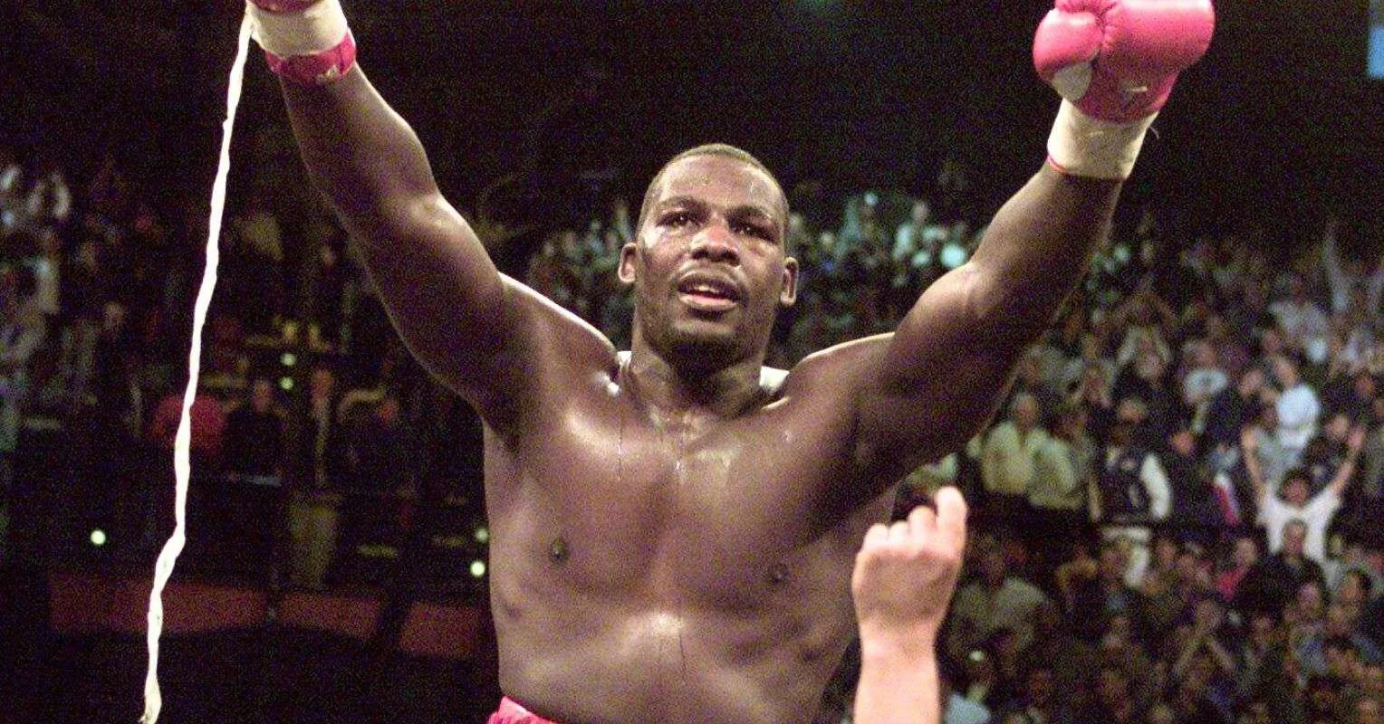 Hasim Rahman celebrates beating Lennox Lewis in their first fight in 2001