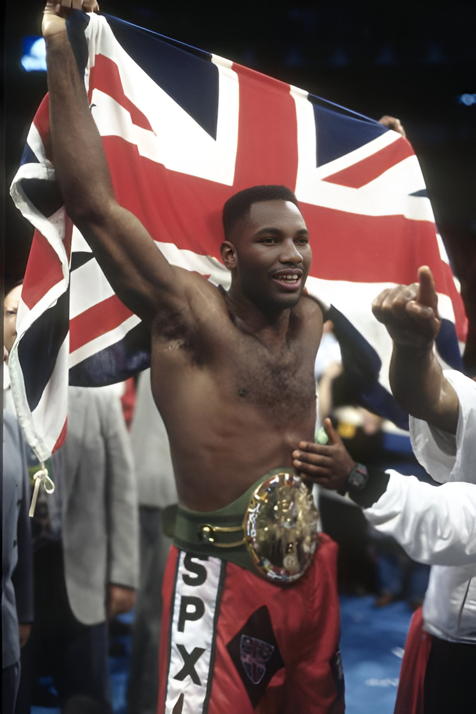 Young Lennox Lewis celebrates winning with Union Jack and WBC belt