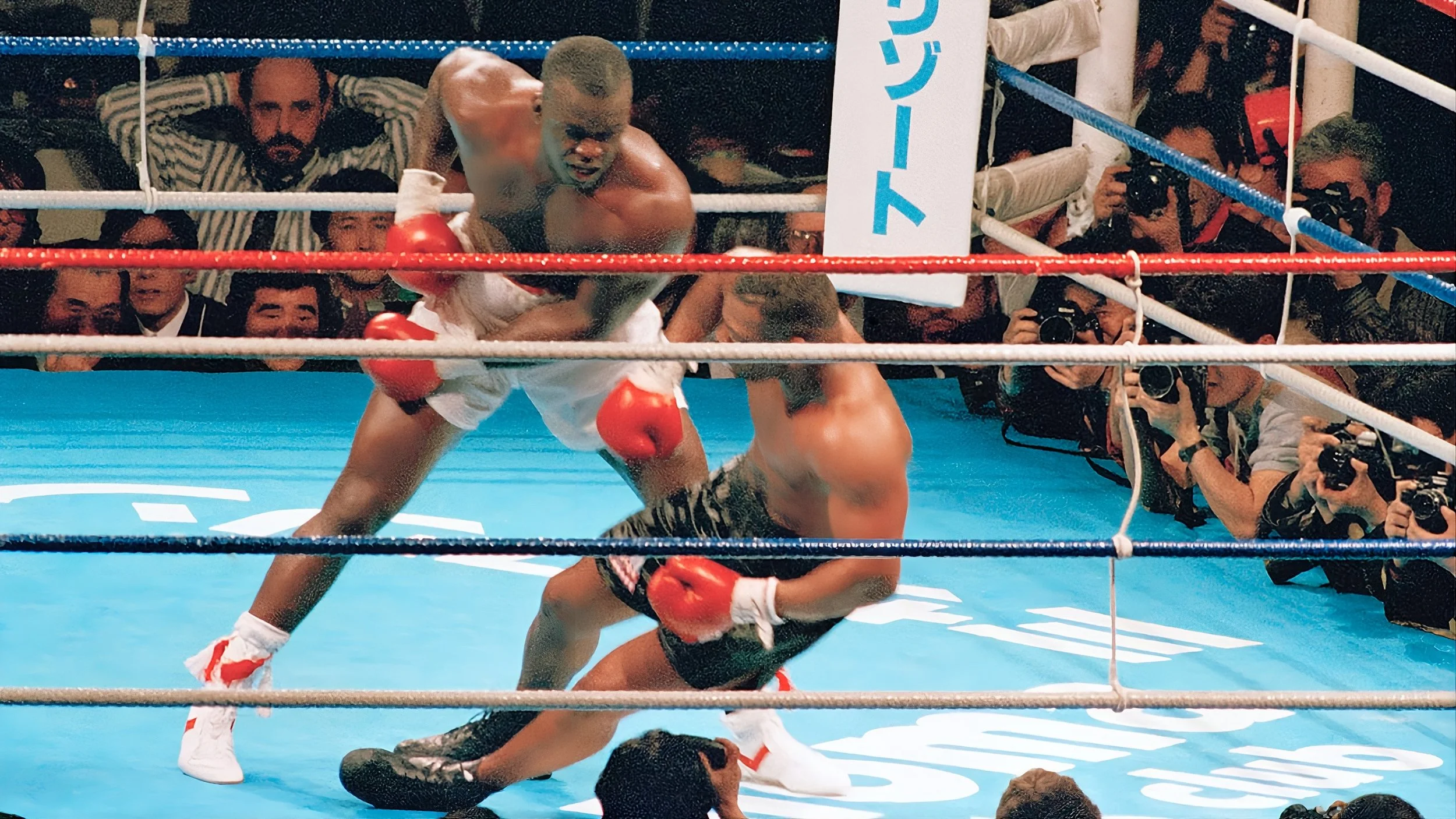 Buster Douglas knocks Mike Tyson down