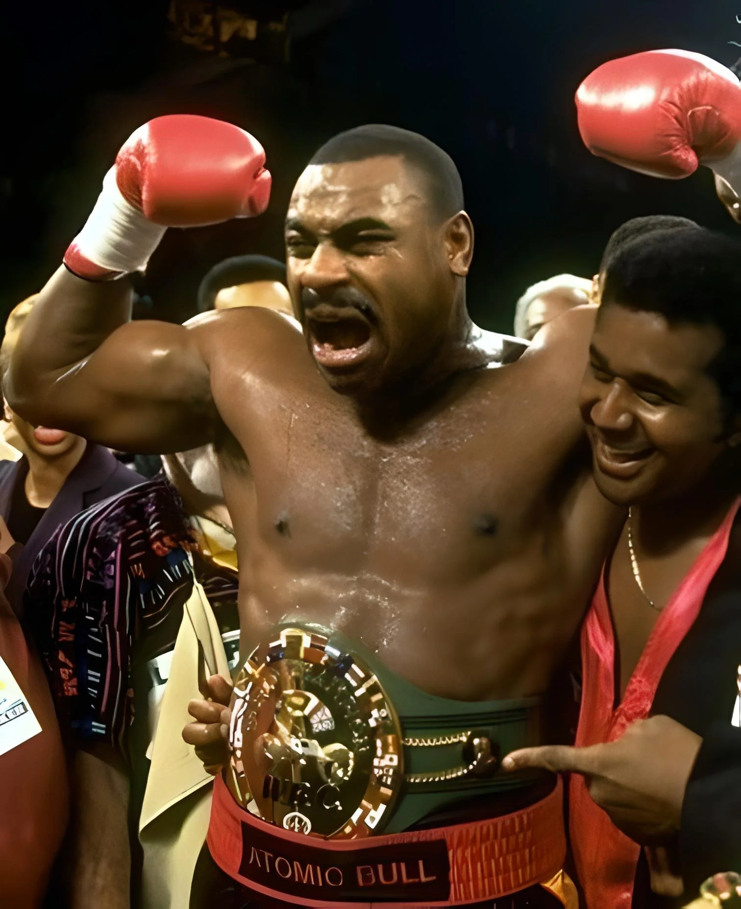 Oliver McCall celebrating win against Lennox Lewis with trainer Emmanuel Steward