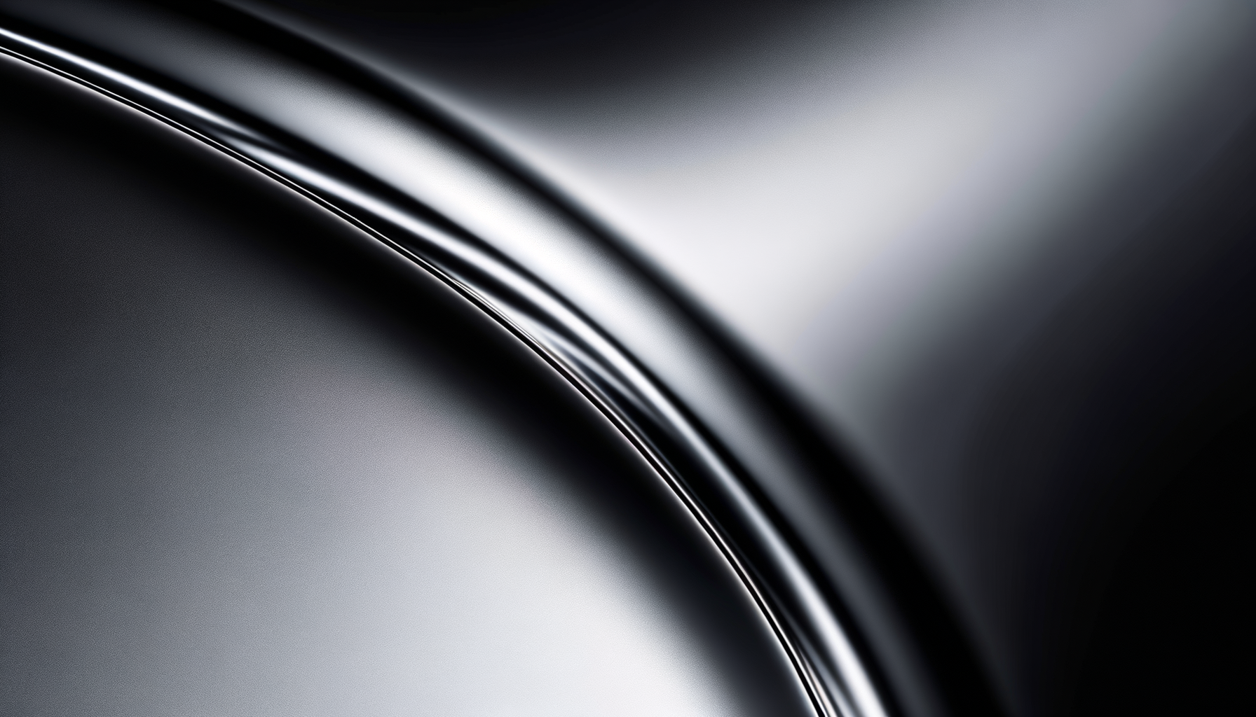 Close-up of a sleek, shiny metallic object with smooth curved surfaces and reflections.
