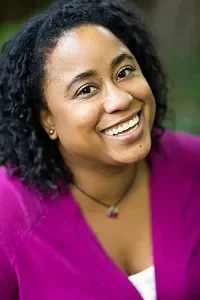 Kimberly Singletary smiling and wearing a magenta sweater
