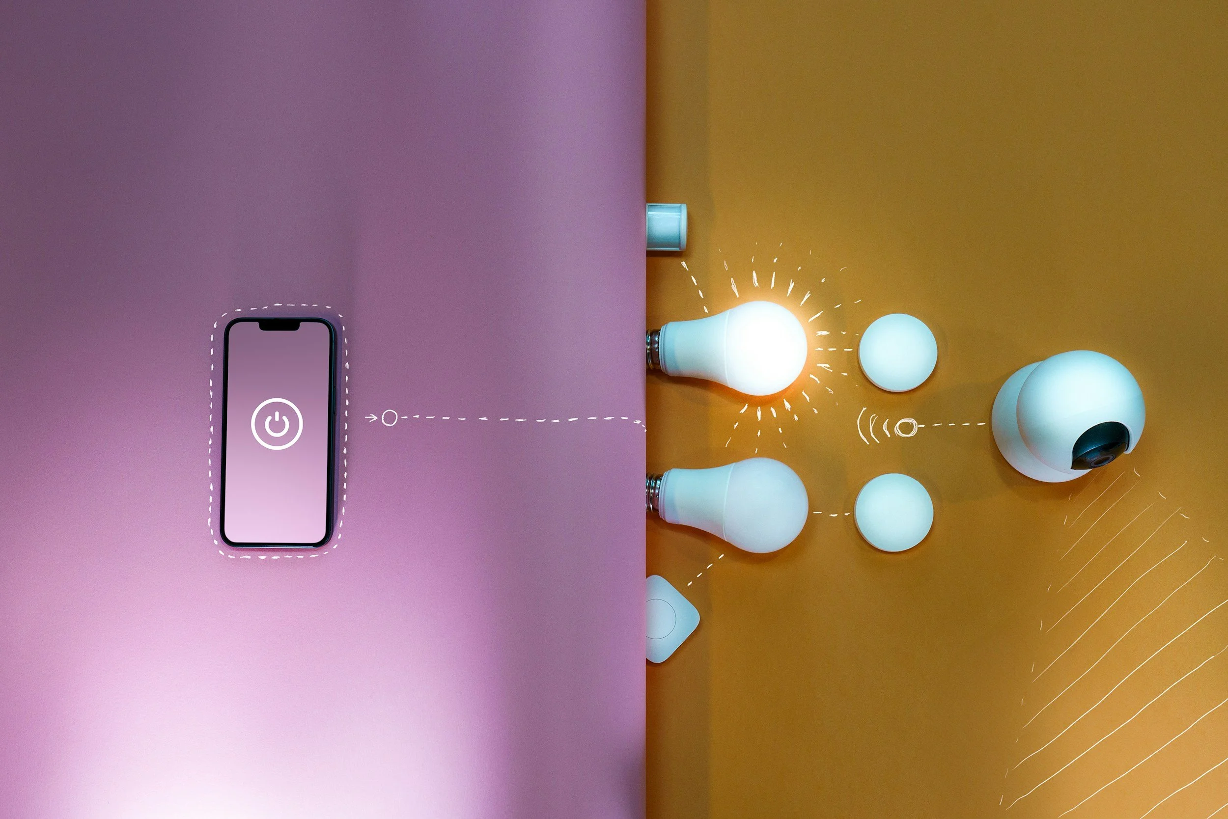 Diagram showing a smartphone with a power button symbol and dashed lines pointing to various smart home light bulbs and a security camera on a split pink and yellow background, illustrating a smart home system.