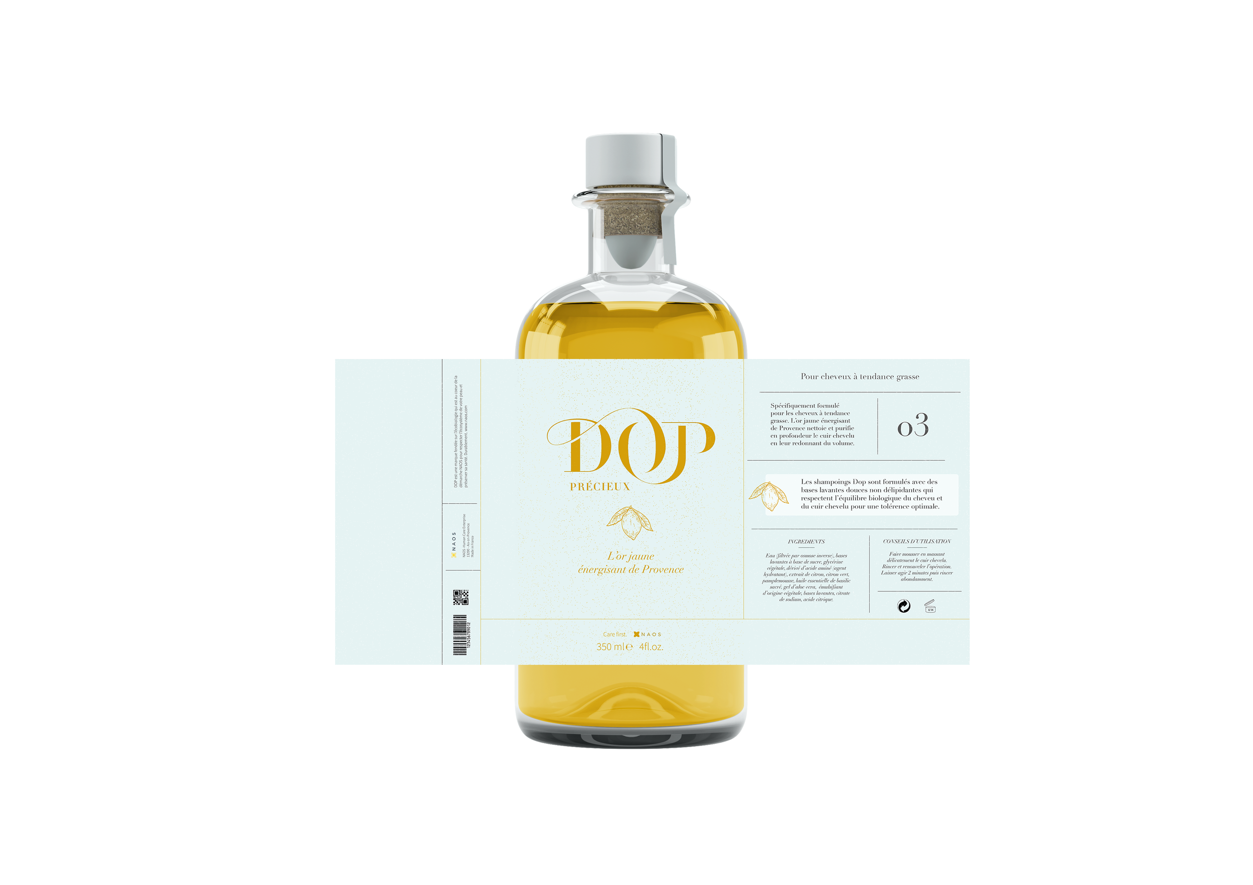 Une bouteille de shampooing avec un emballage présentant une étiquette blanche et or, contenant de l'huile de jaune d'or, et des informations écrites en français.