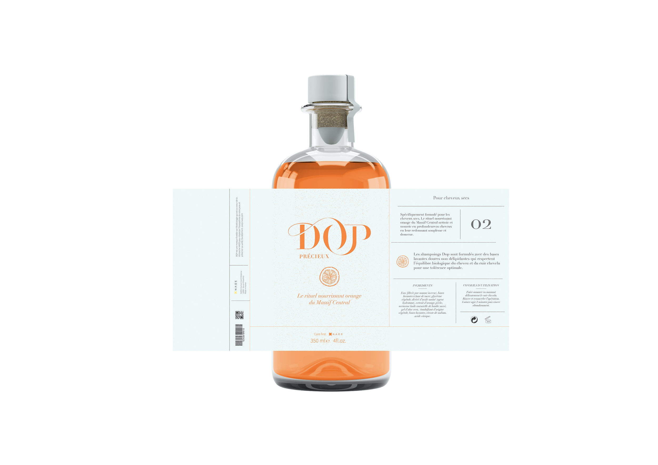 Une bouteille en verre contenant une lotion orange, avec une étiquette blanche et orange pliée autour du col, présentant un produit de soins capillaires pour cheveux secs nommé 'DOP précieux' avec une illustration d'une tranche d'orange.