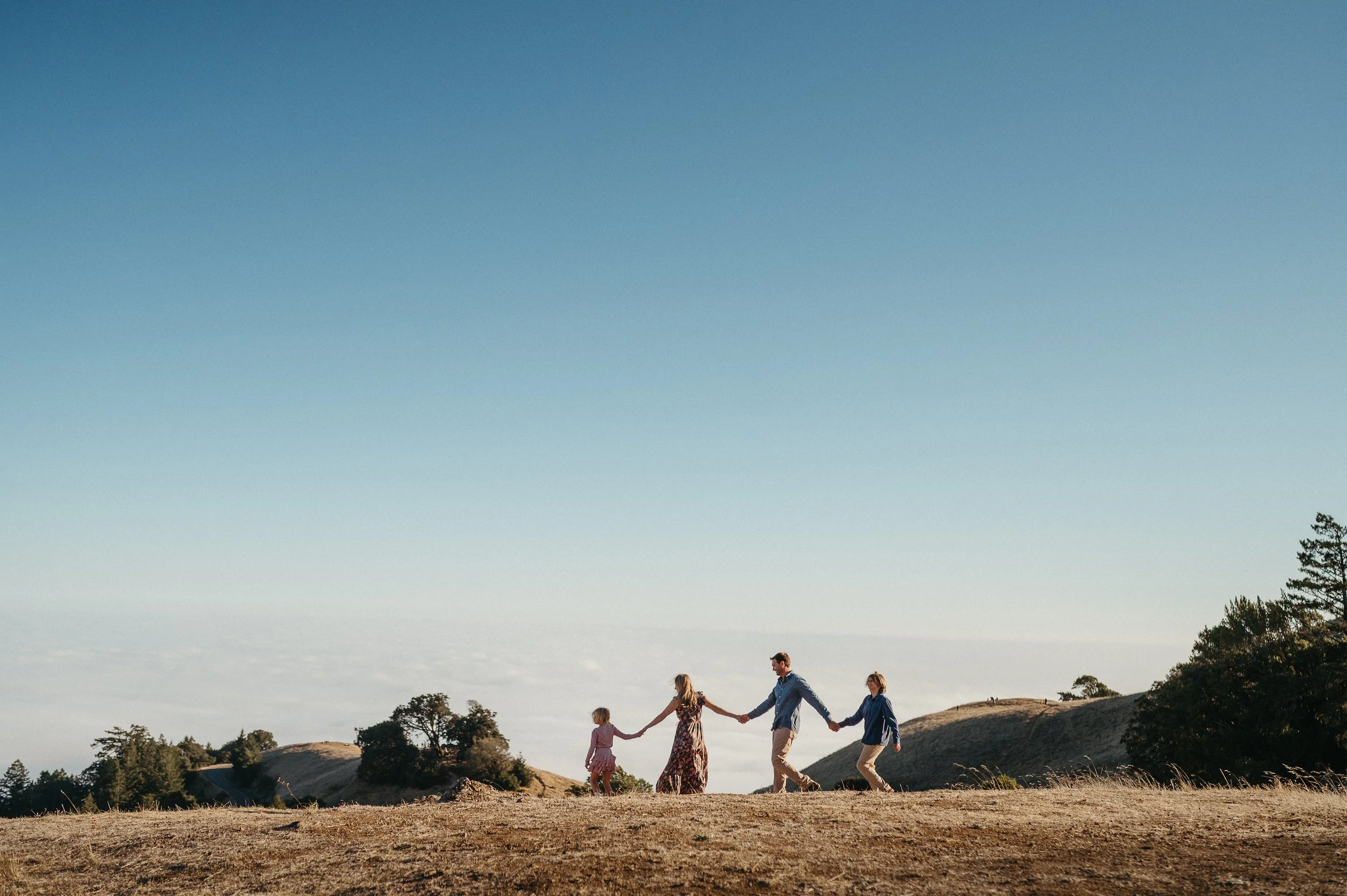 Chase Fontaine and his family walking together in the Marin hills