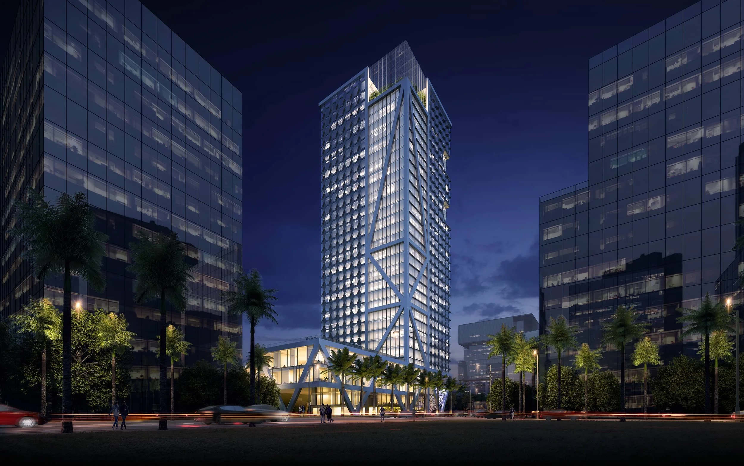 Night view of a modern high-rise building with a geometric facade, surrounded by palm trees and other office buildings, with light trails from cars on the street below.