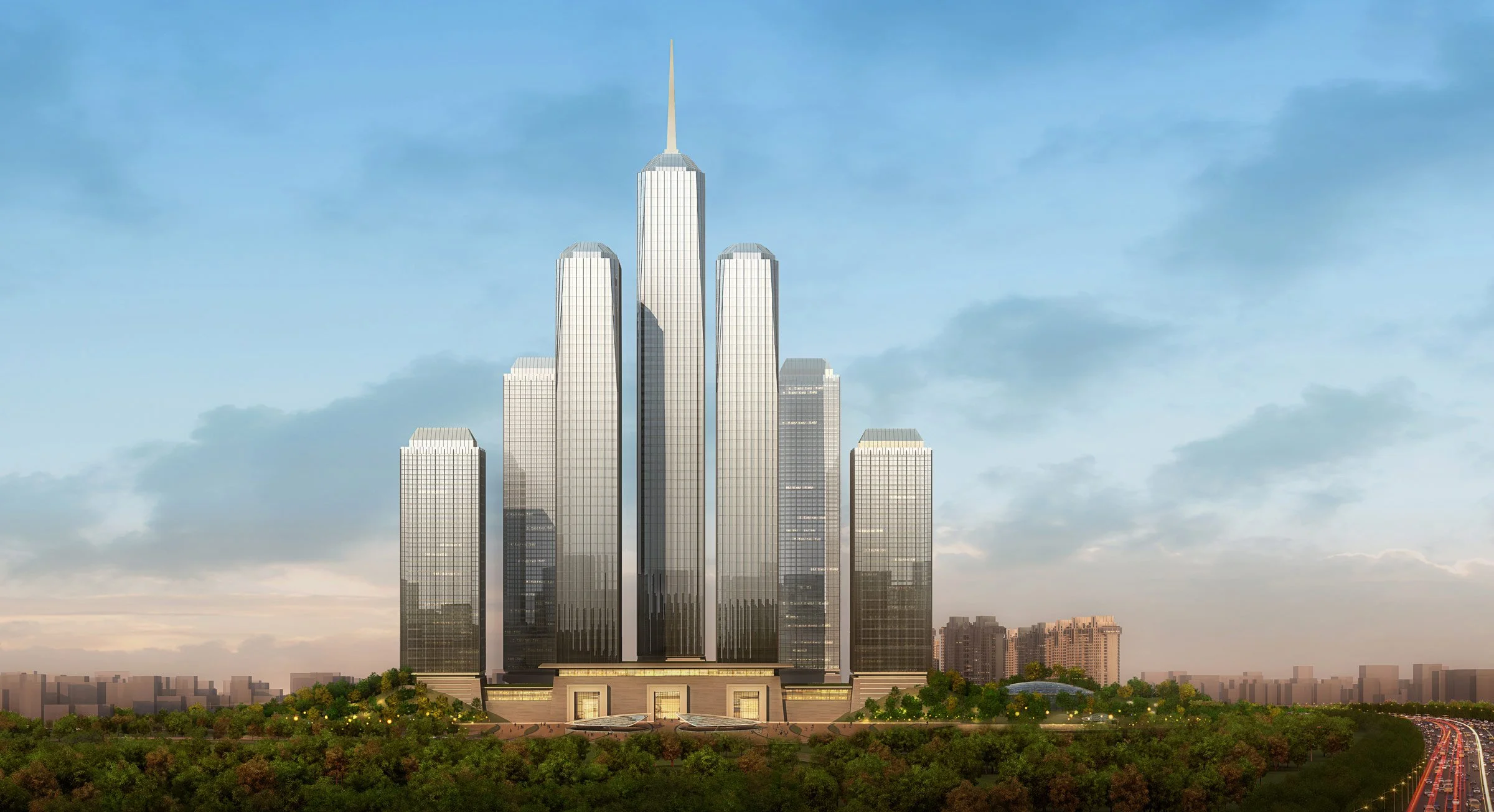 A tall modern skyscraper with a spire on top, surrounded by other high-rise buildings, set against a blue sky with some clouds, with a green park and cityscape in the foreground.
