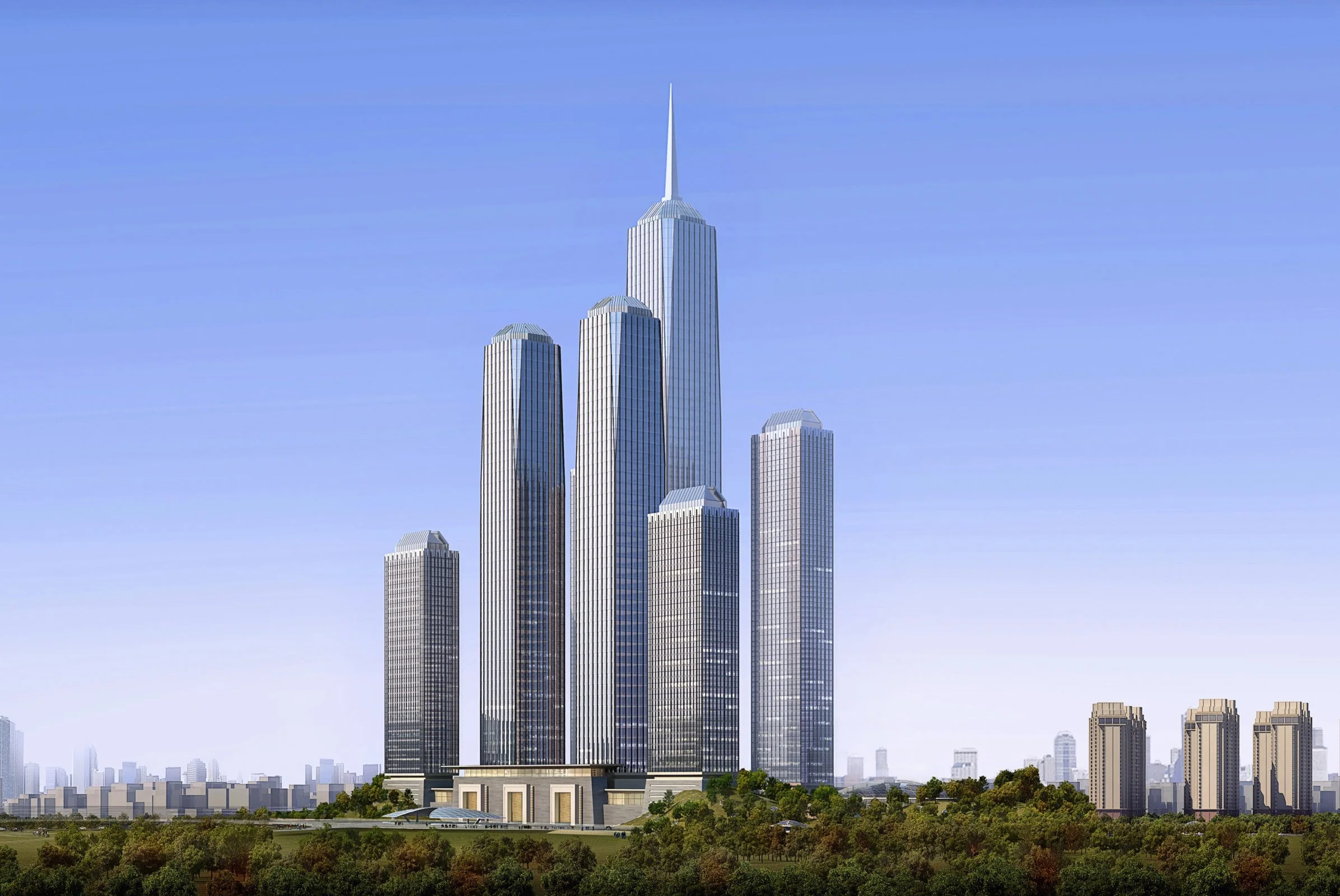 Modern skyscraper towers in a city skyline with a clear blue sky, surrounded by greenery.
