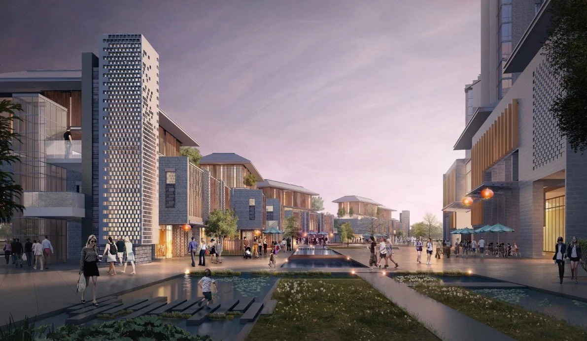 A modern urban plaza with multi-story buildings, people walking, and a small water feature in the foreground during dusk.