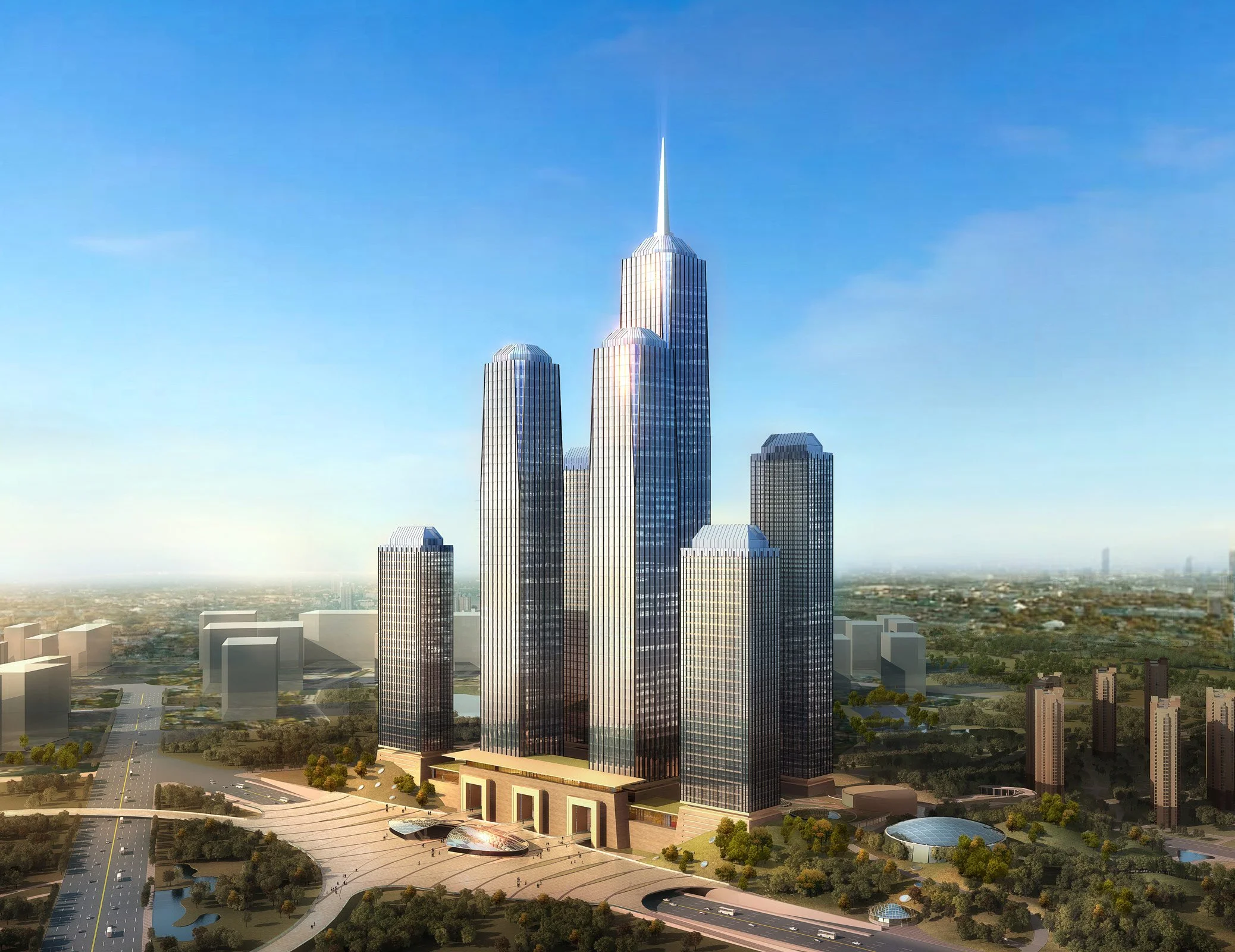 A modern cityscape with tall glass skyscrapers, including a prominent tallest building with a spire, set against a clear blue sky and surrounding urban area with trees and roads.