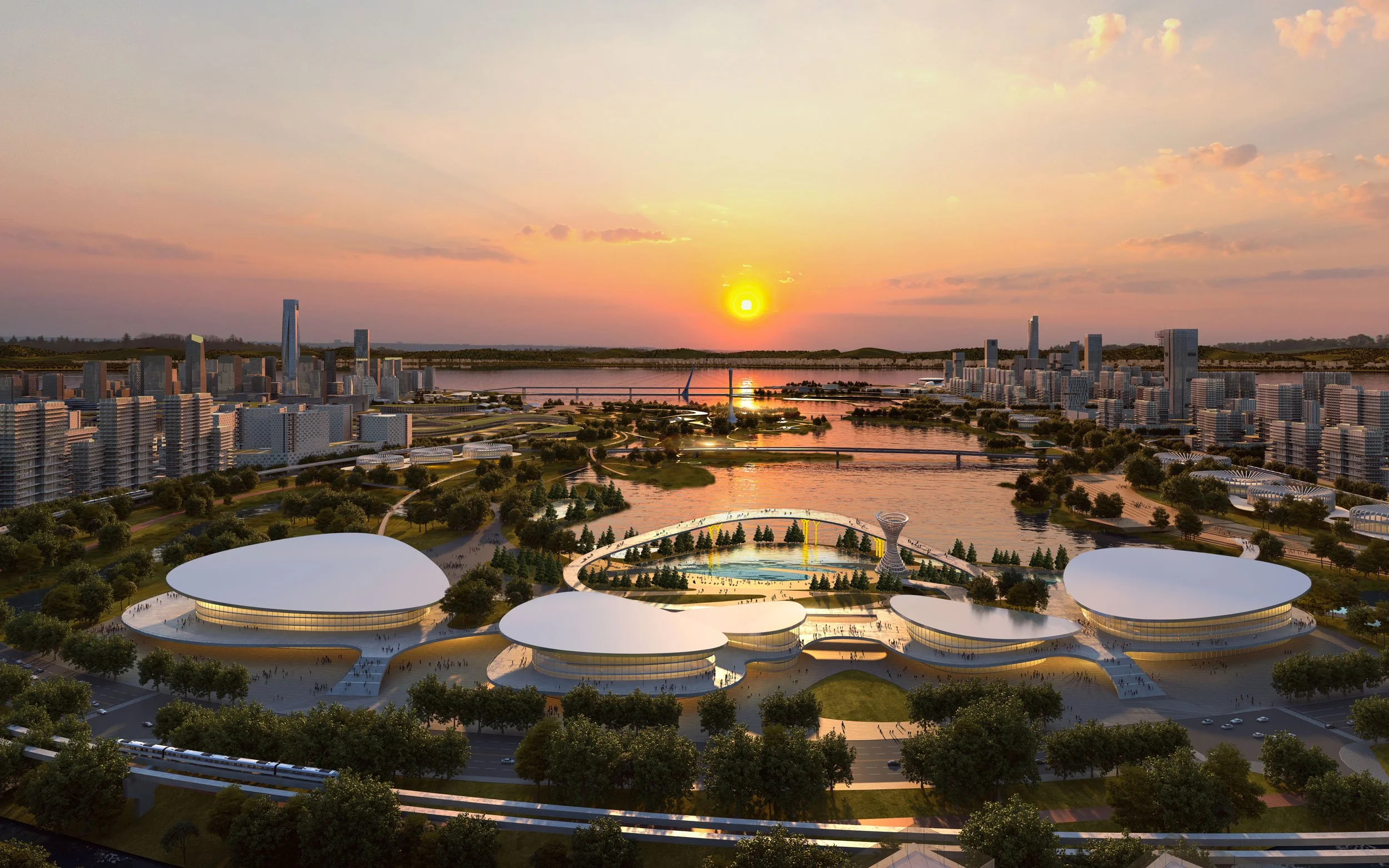 A futuristic cityscape at sunset with modern buildings, a river, a park, and office or exhibition buildings with curved, white roofs.