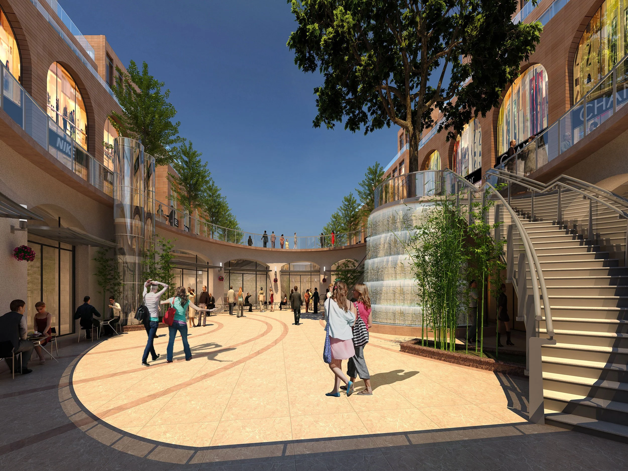 People shopping and walking in an outdoor shopping mall with modern architecture, glass railings, and landscaping with trees and plants.