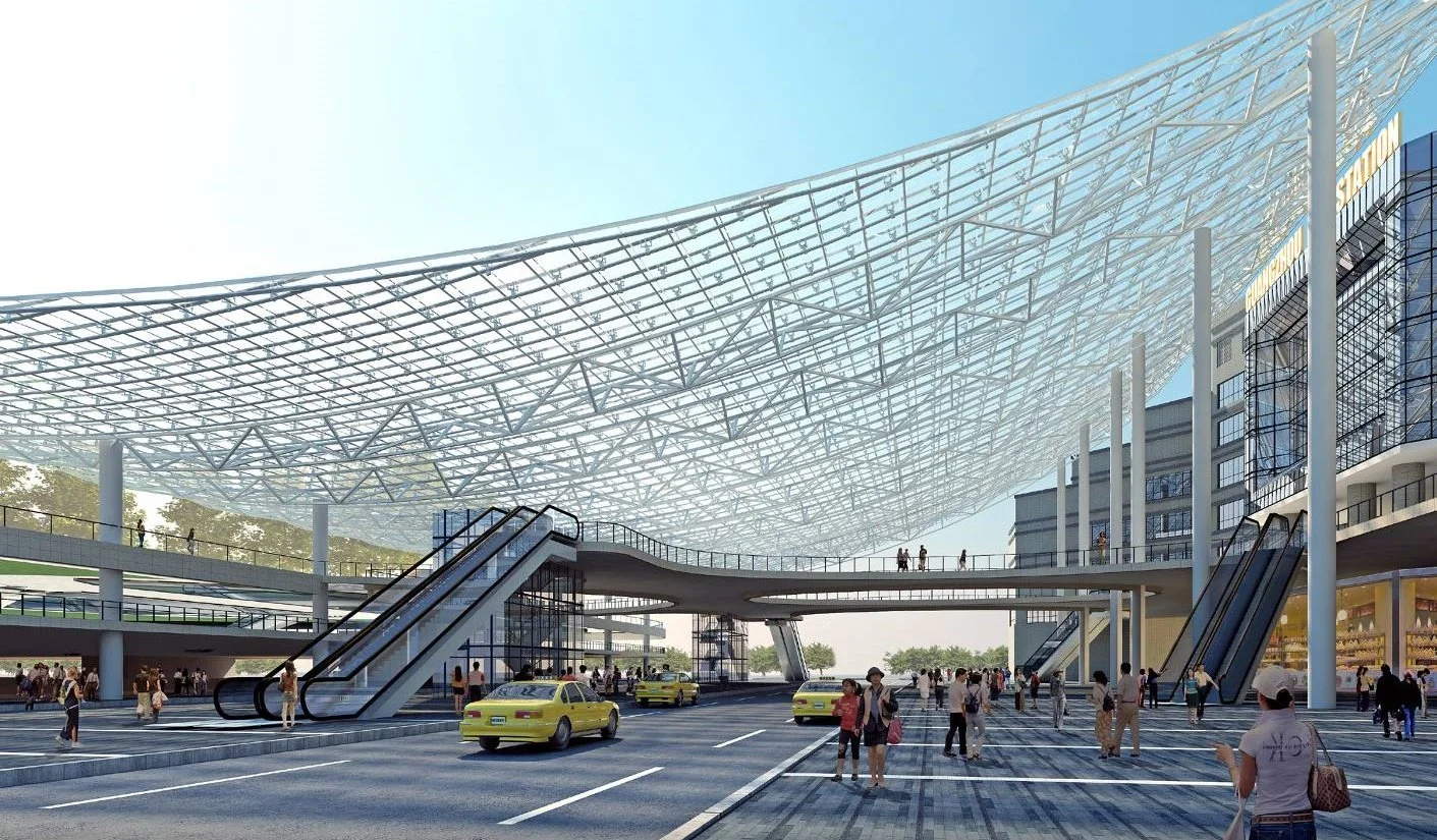 Modern airport terminal with a large glass and steel roof, multiple levels, and yellow taxis in the foreground.