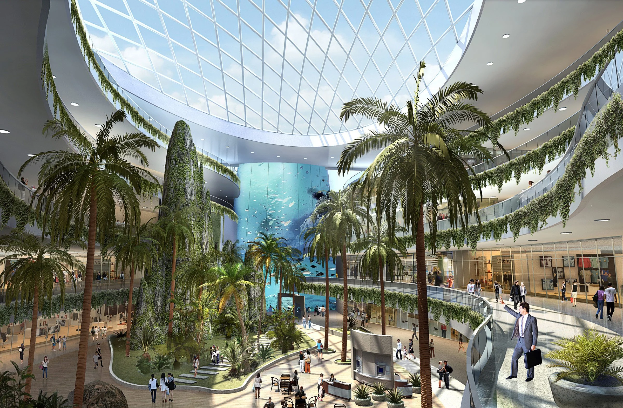 Interior view of a modern shopping mall with a tropical theme. There are tall palm trees, lush greenery, a waterfall feature, and a large glass ceiling letting in natural light. Multiple levels with shops and people walking around.