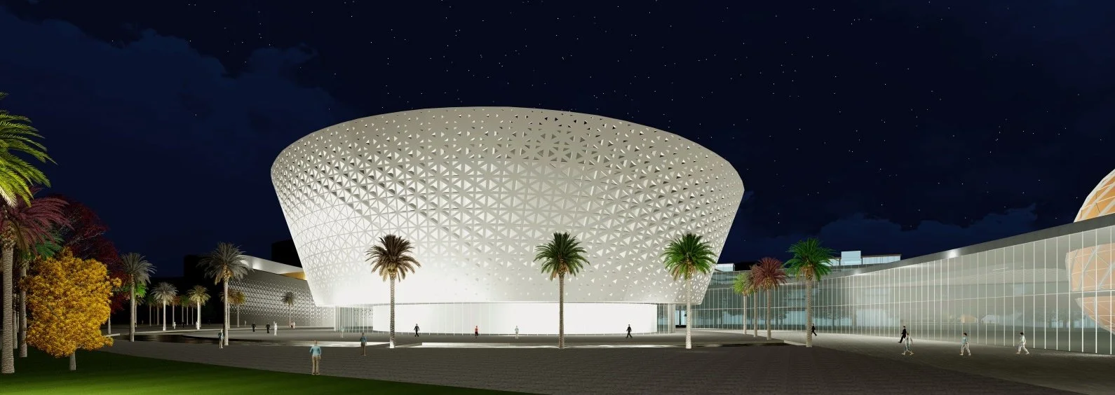 Night view of a modern building with a large, rounded, lattice exterior structure, surrounded by palm trees and people walking.