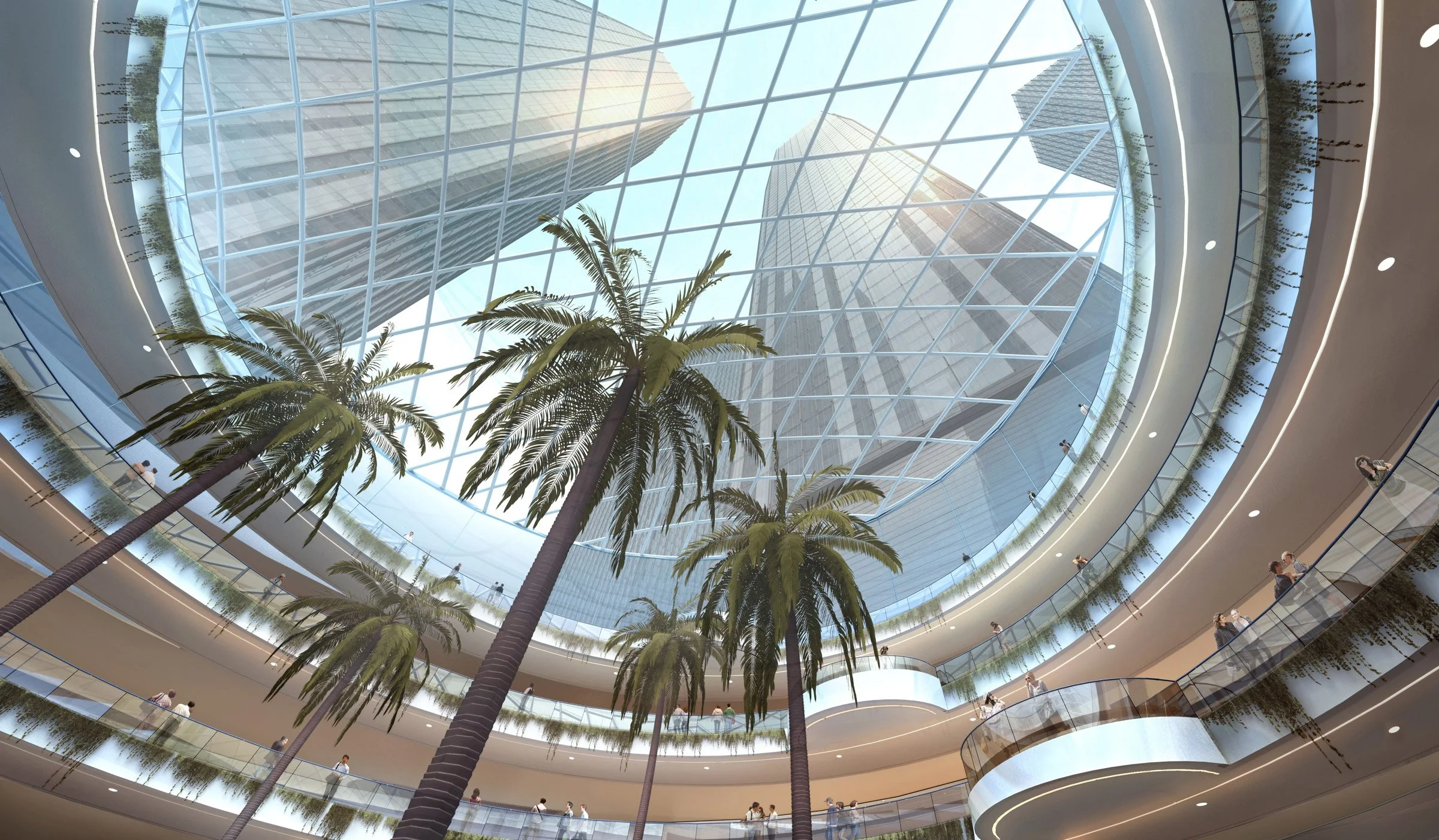 Interior view of a modern shopping mall with multiple levels, tall palm trees, and a glass roof allowing natural light to enter.