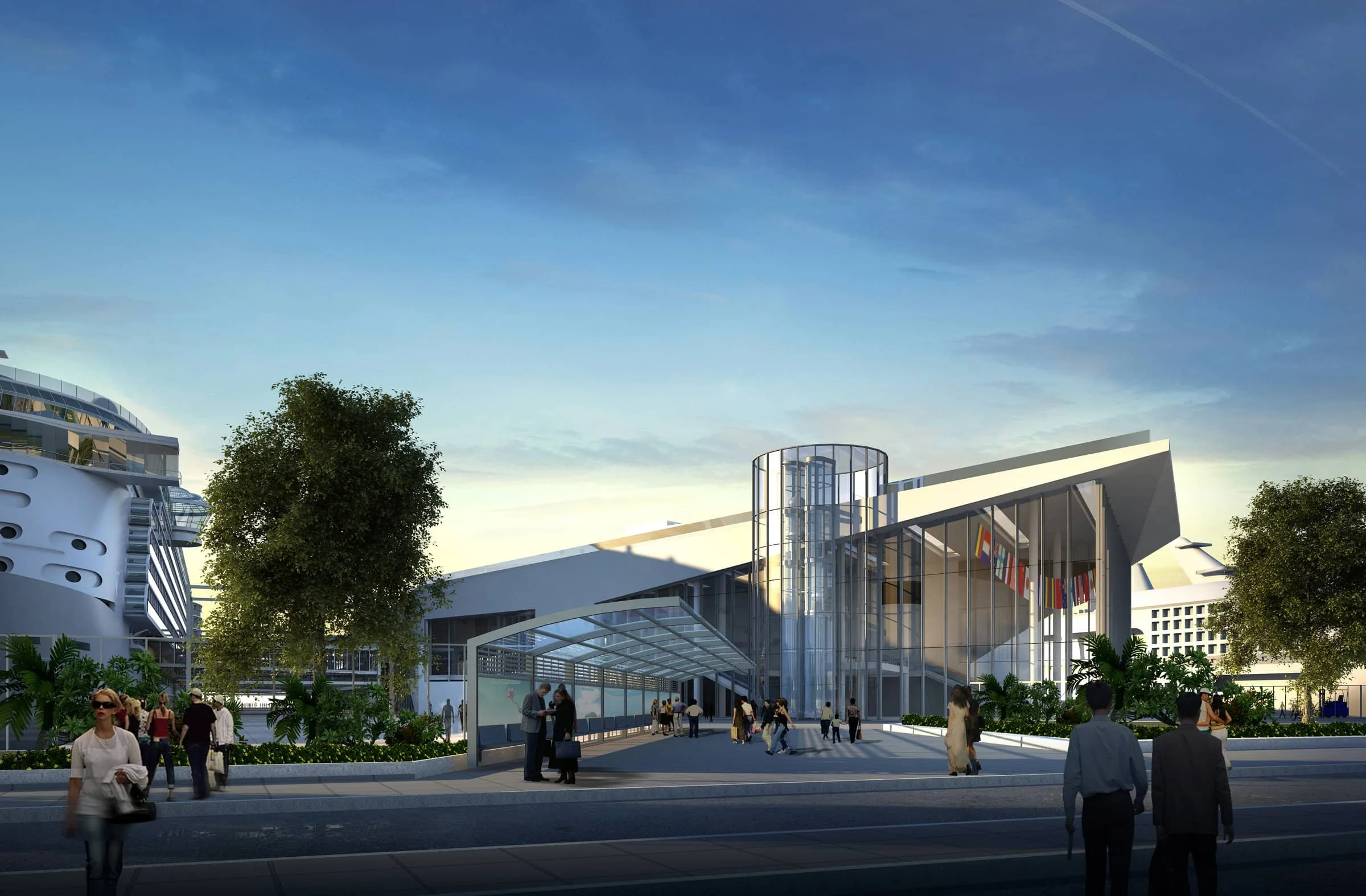 Modern building with glass entrance, surrounded by trees and people walking in the vicinity.