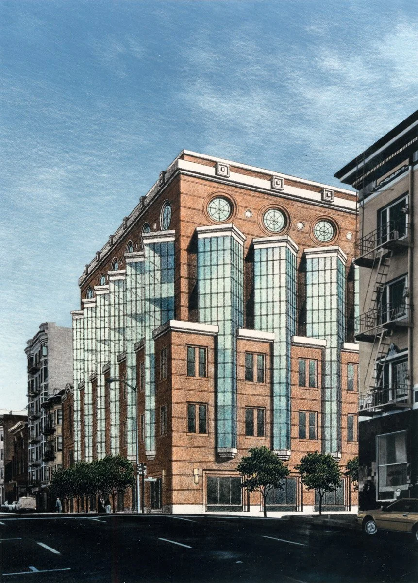 A modern multi-story building with brick and glass facade on a city street, with trees and parked cars in the foreground and a blue sky above.