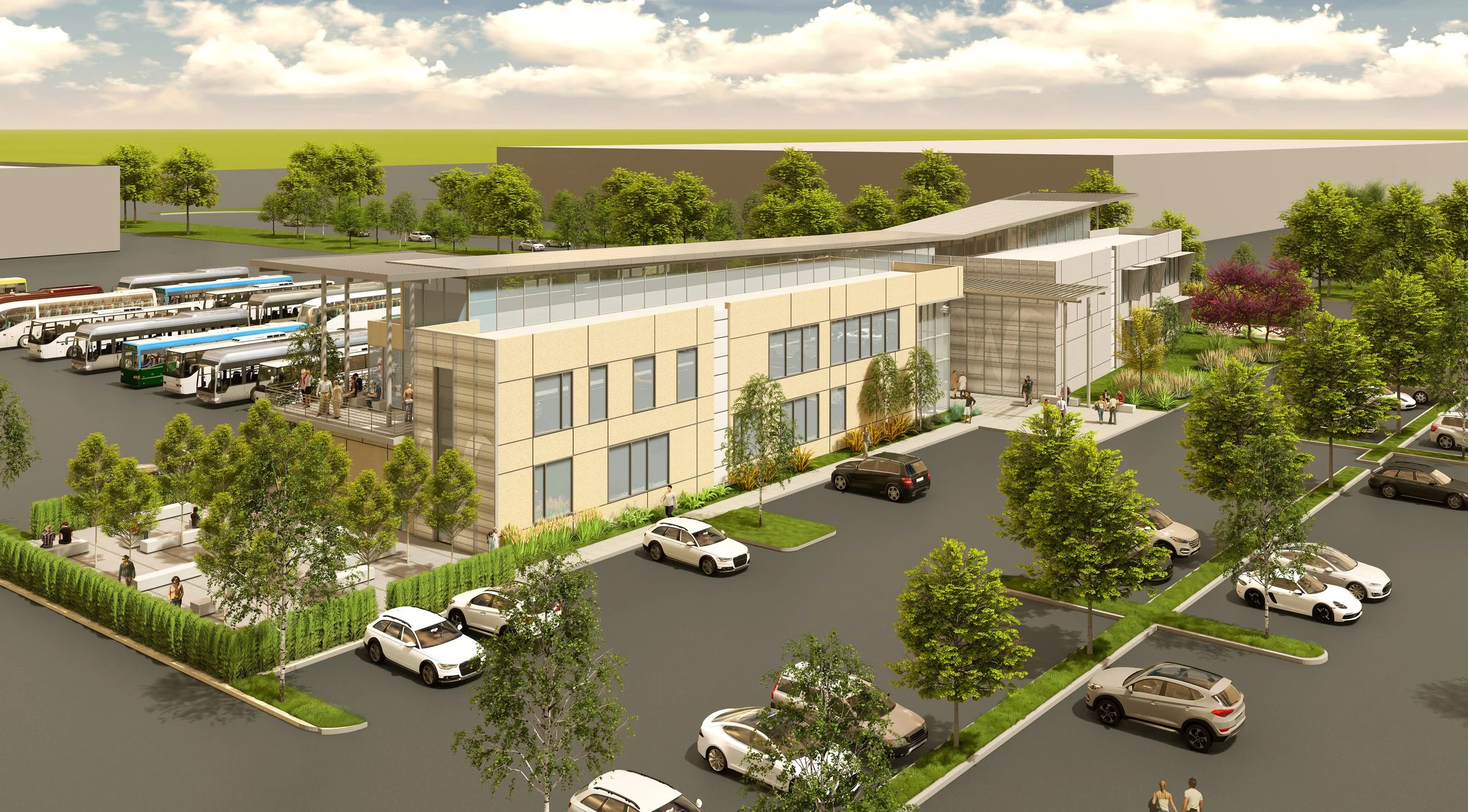 A modern bus terminal with multiple buses parked and people walking around, surrounded by trees and parking lots in an urban setting.