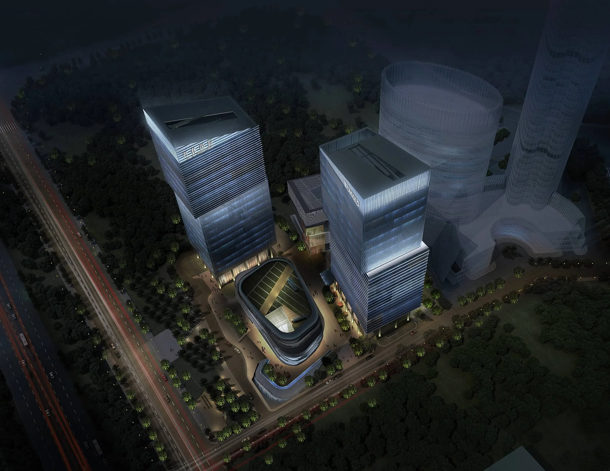 Nighttime aerial view of a modern architectural complex with high-rise buildings, illuminated with blue lights, surrounded by trees and a road with vehicle lights passing by.