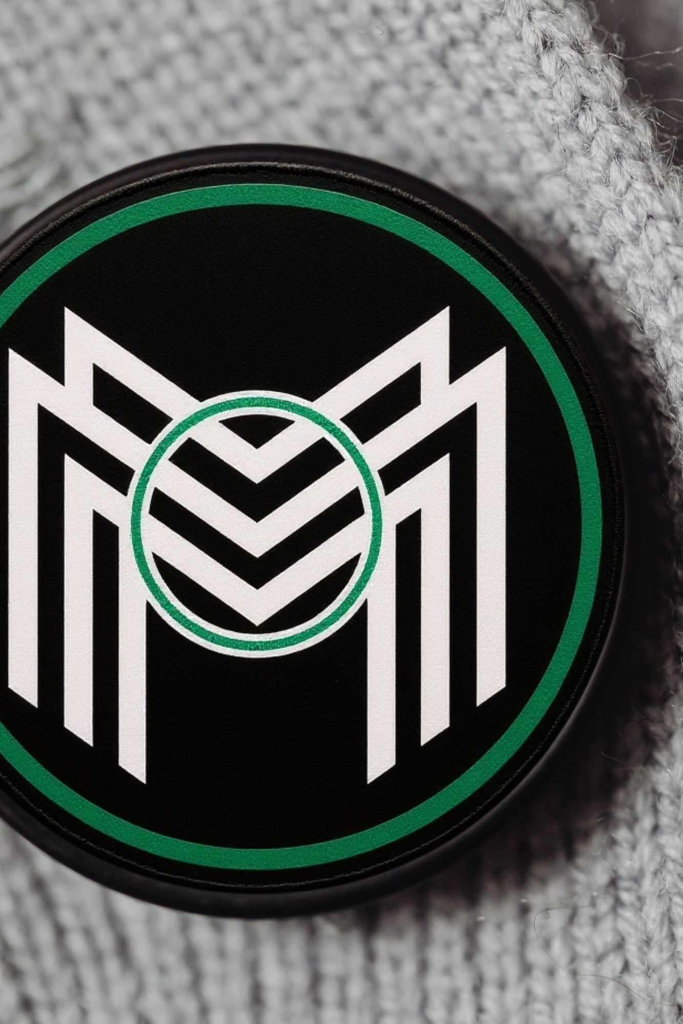 Minigma Woven NFT tag embedded in fabric for secure product authentication and owner verification.