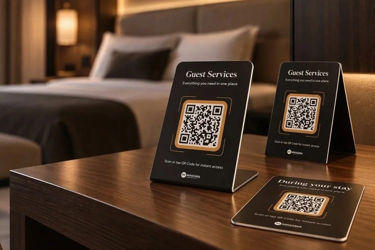 Custom-designed Minigma guest service stands displayed in a hotel room, providing access to digital concierge information and services.