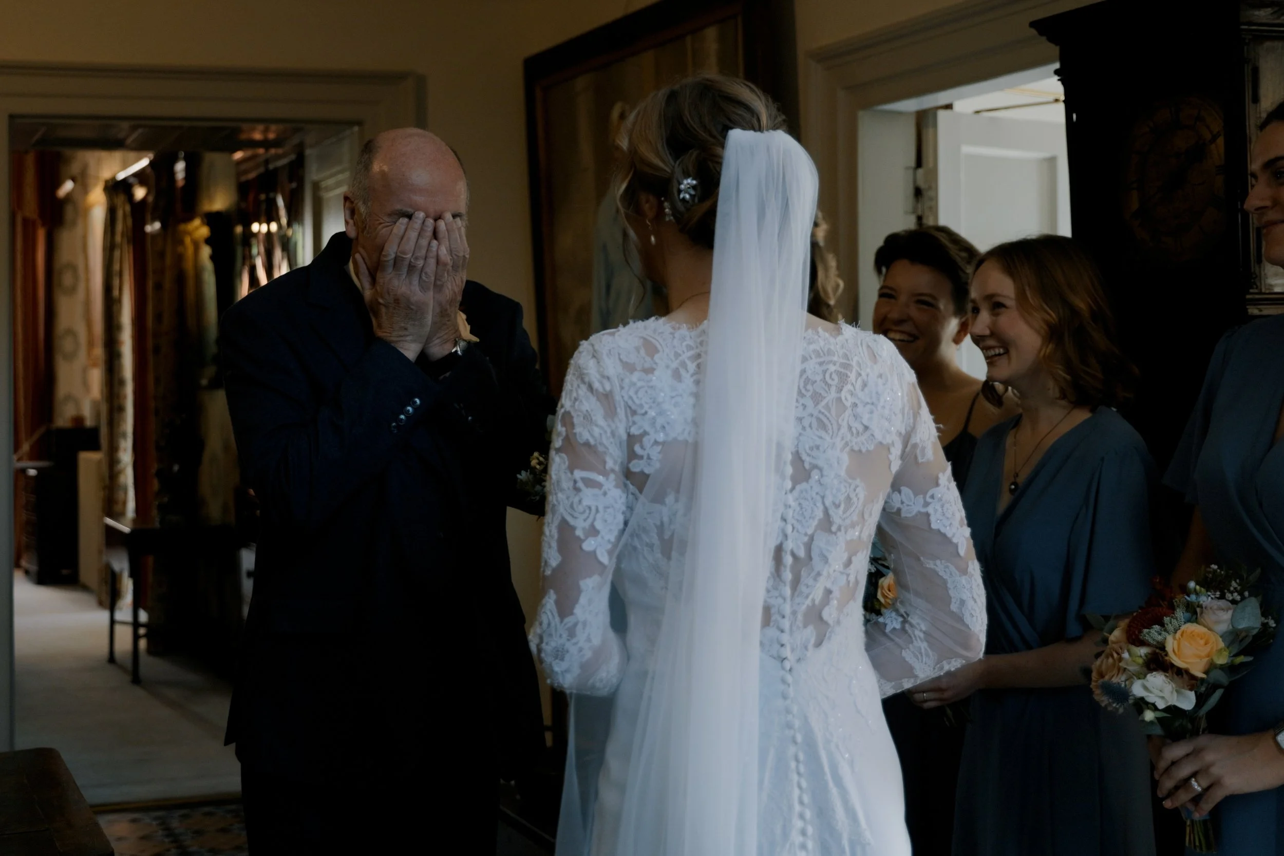 A father of the bride seeing his daughter for the first time at a Pennard House wedding