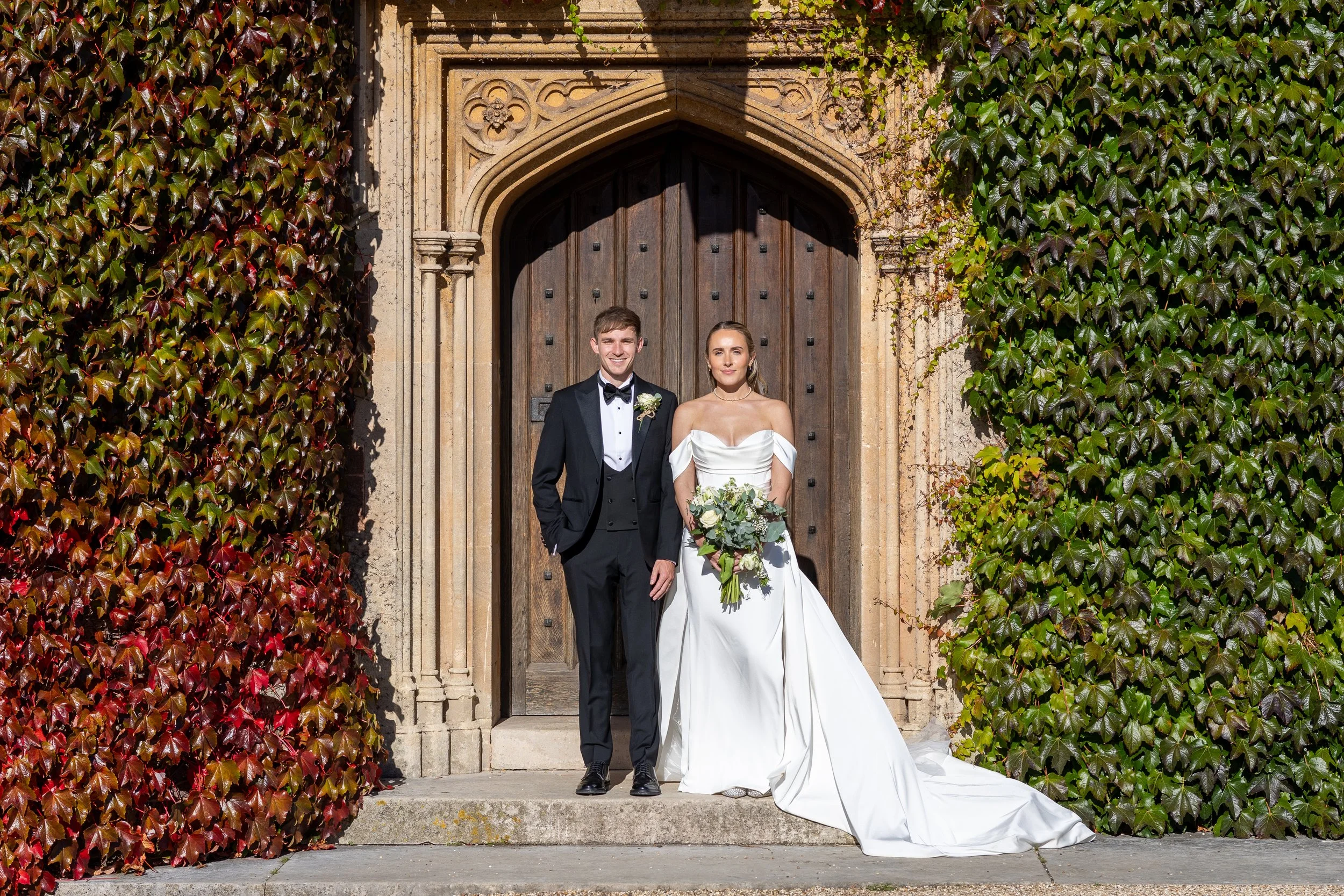 Bride and groom stood in frond of St Audries Park Somerset