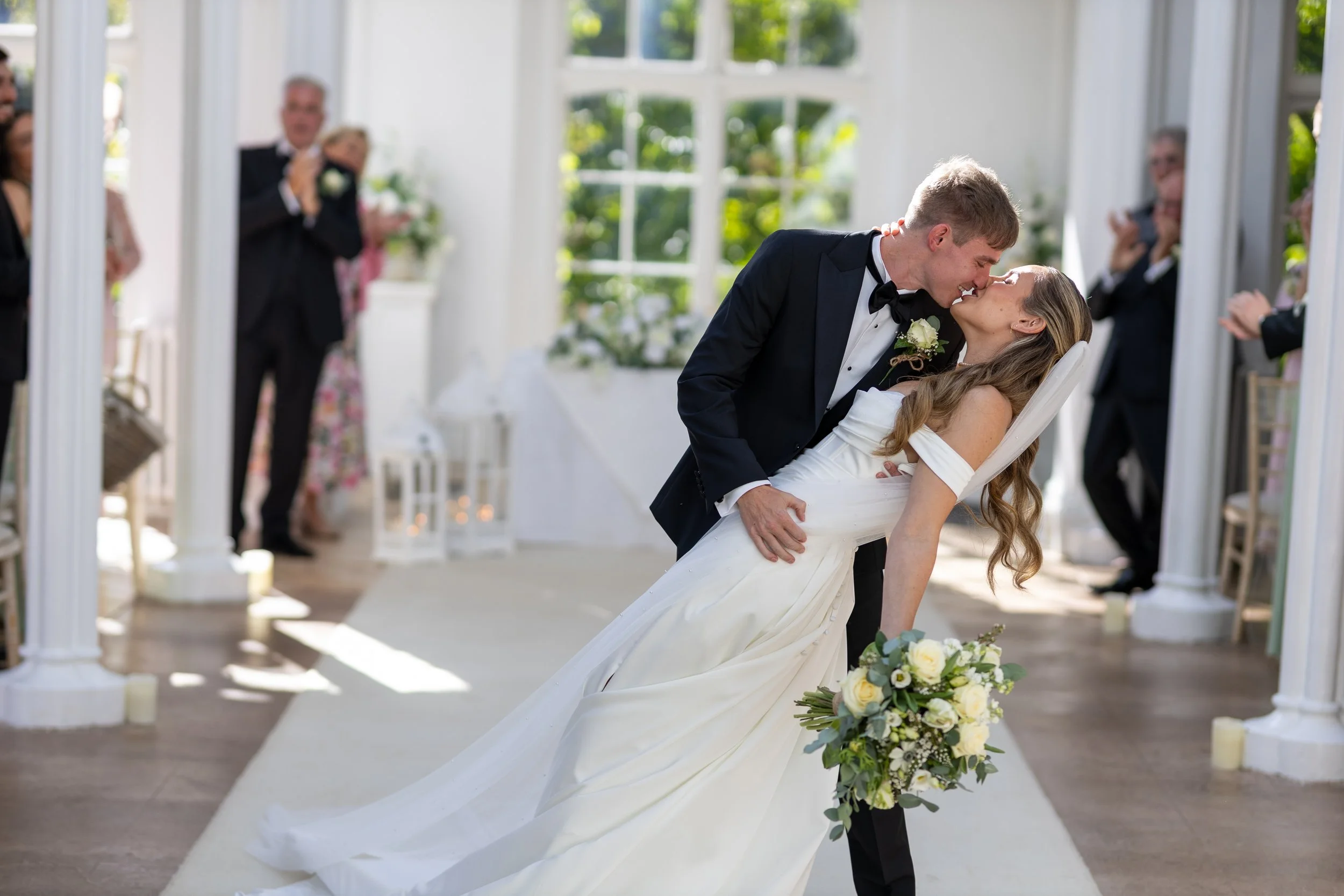 Newly weds celebrating after their St Audries Park wedding ceremony