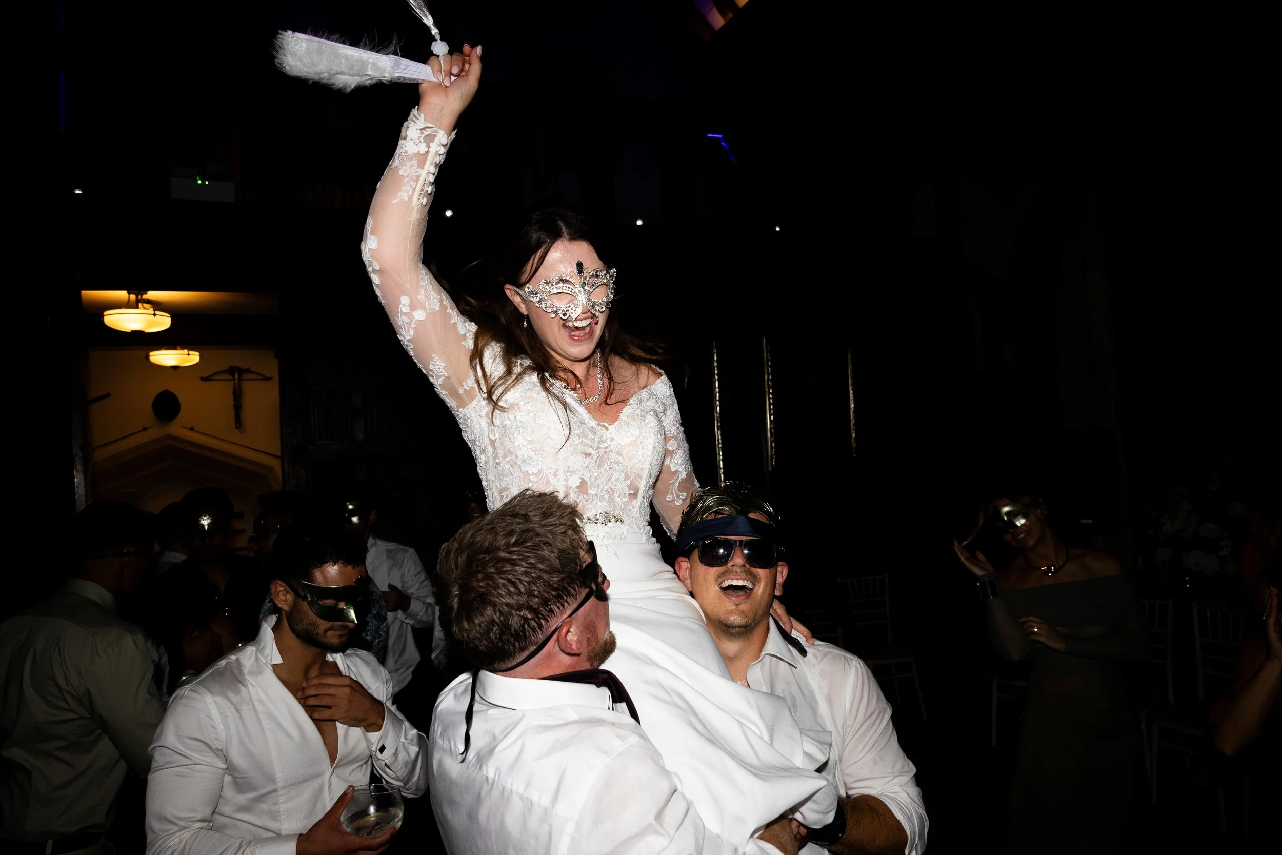 Bride being lifted in the air on her wedding night at Berkeley Castle