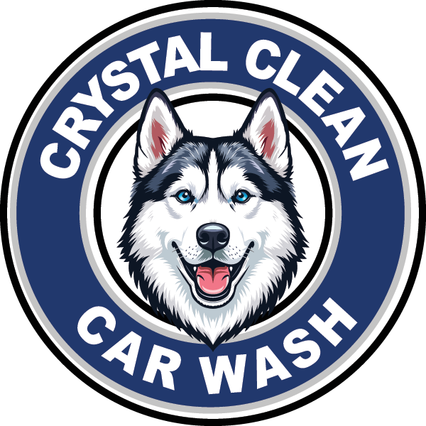 Logo for Crystal Clean Car Wash featuring a smiling husky dog with blue eyes, surrounded by the text 'Crystal Clean Car Wash' in a circular design.