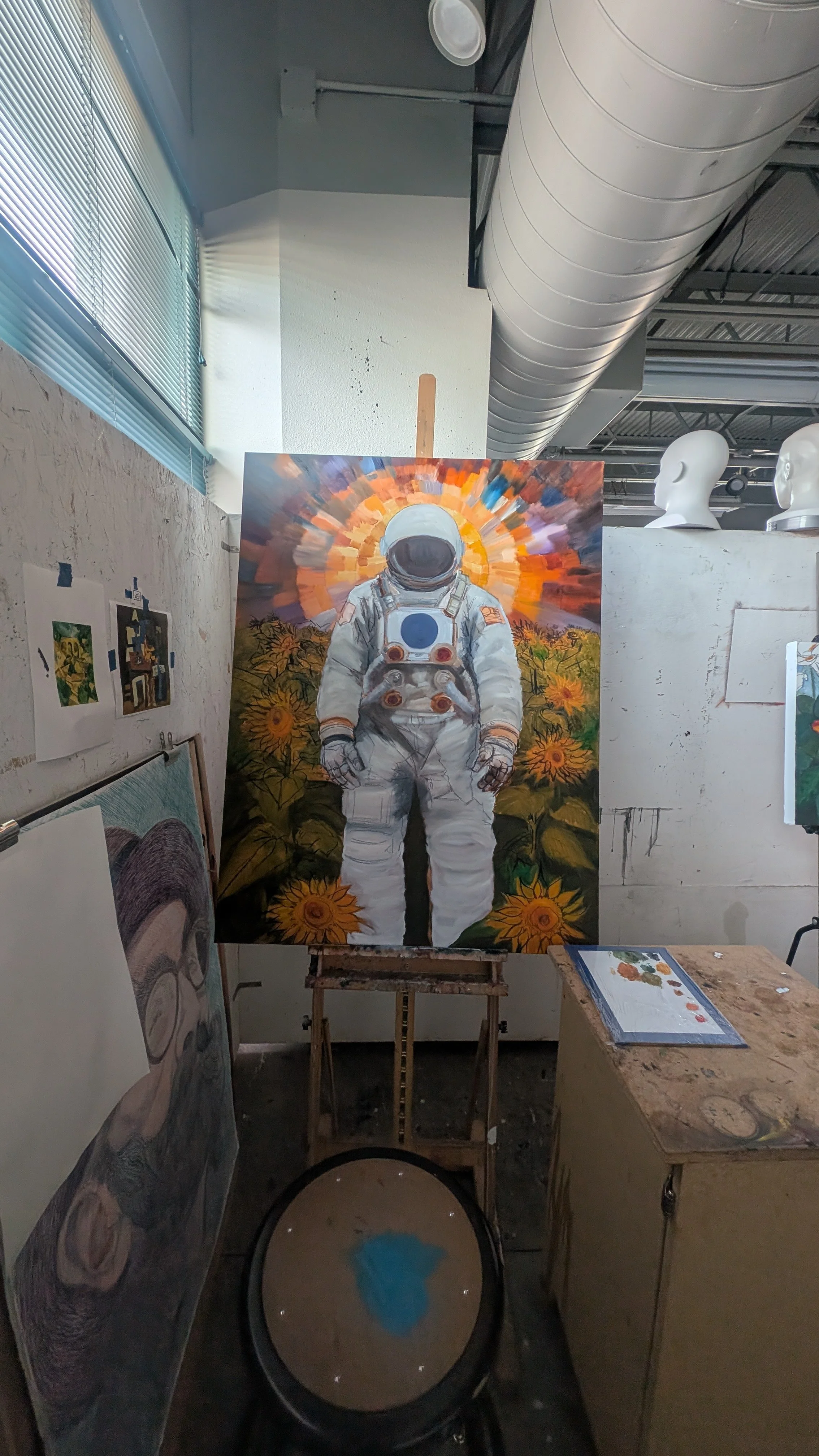 A painting of an astronaut standing among sunflowers, with a colorful, radiant background behind the astronaut.