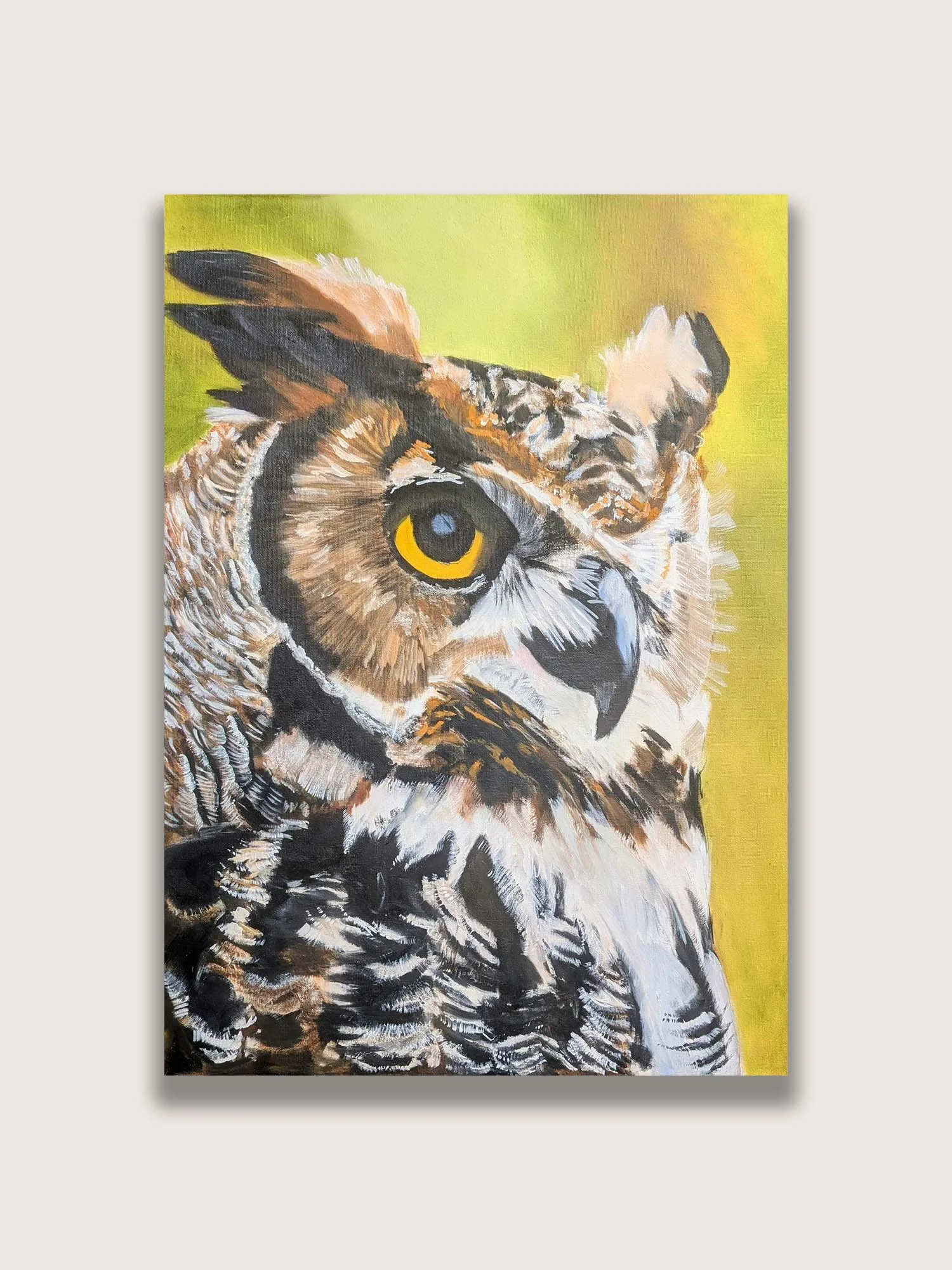 Wildlife oil painting of a great horned owl with vibrant yellow eyes and detailed feather textures. Contemporary nature artwork exploring themes of wisdom, awareness, conservation, and the majesty of North American birds of prey.