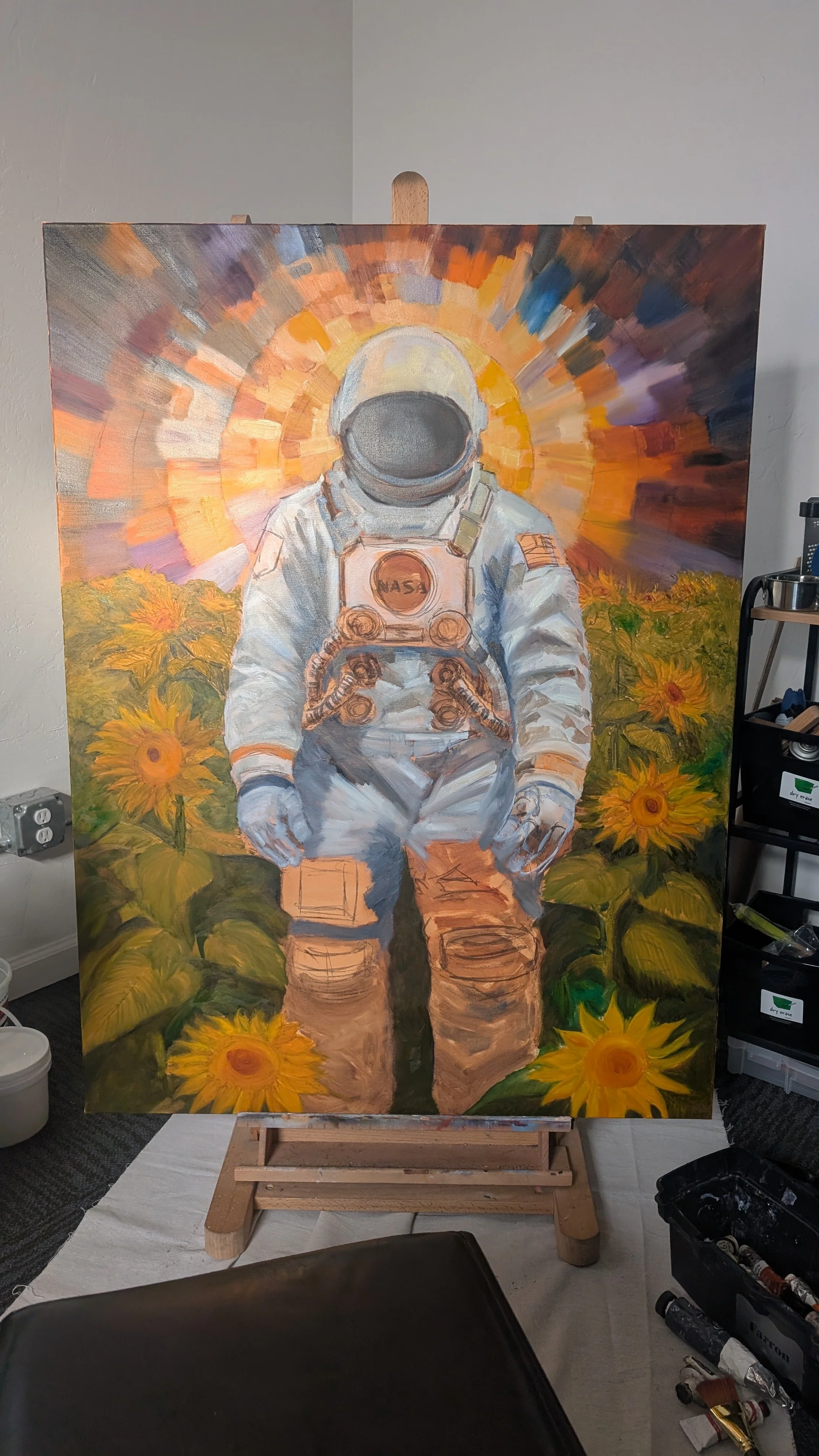 A painting of an astronaut standing in a sunflower field with a vibrant, colorful sunset in the background.