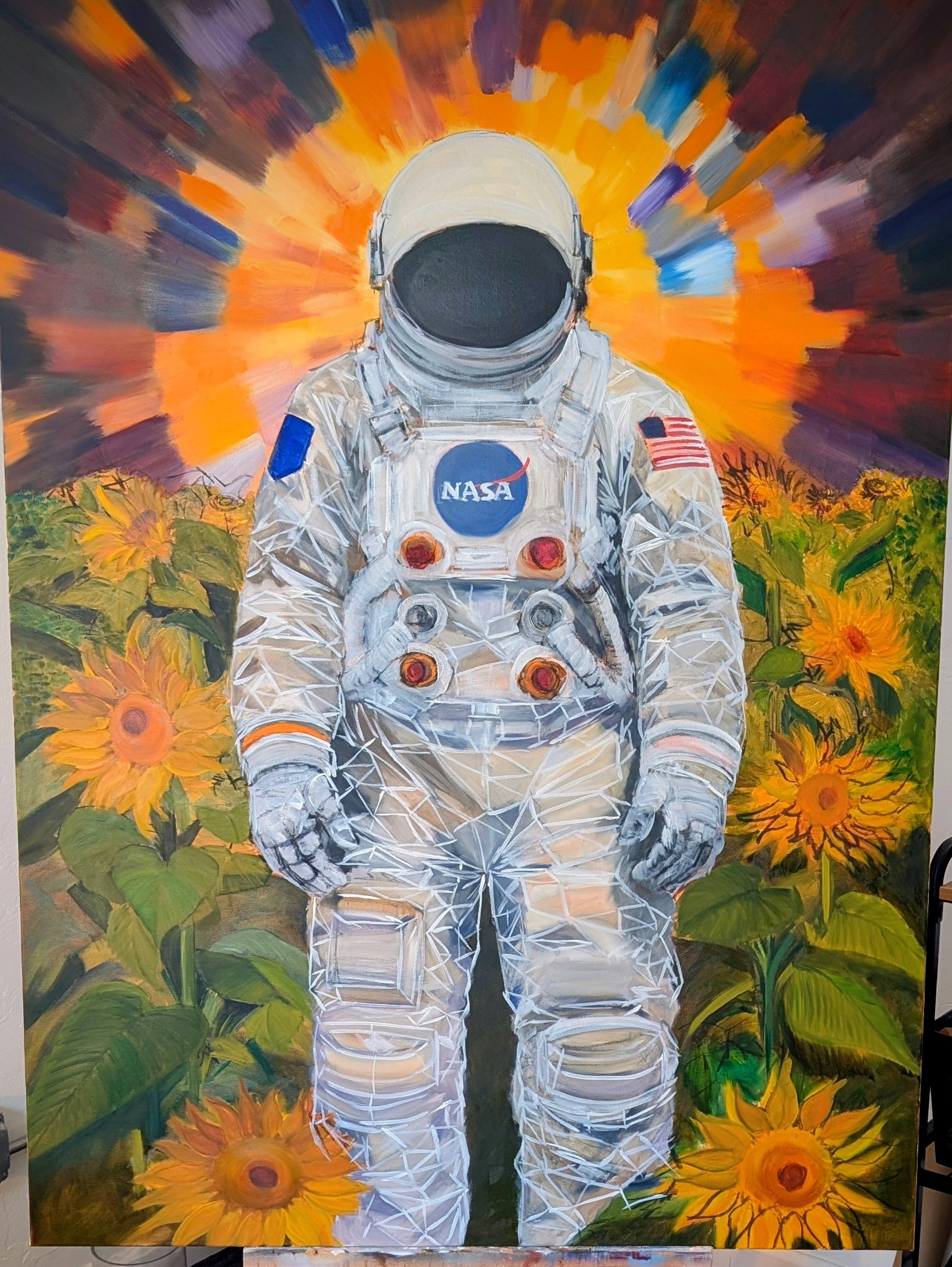 Painting of an astronaut in a white space suit with NASA and American flag patches, standing amidst a field of sunflowers, with a vibrant orange and purple abstract background resembling a sunrise or sunset.