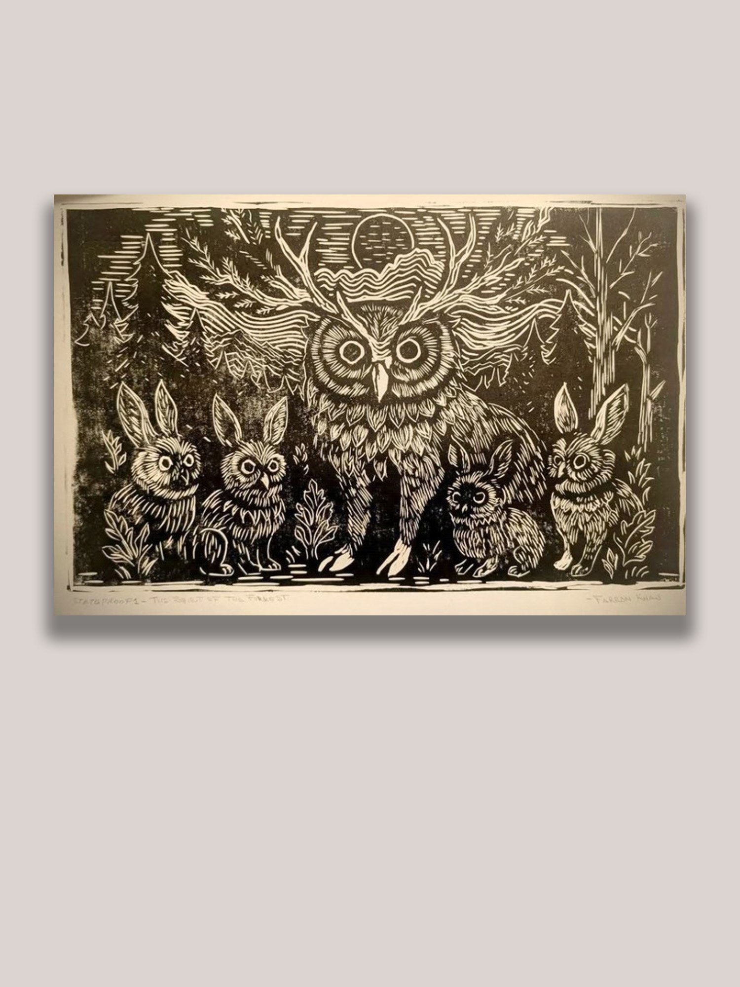 Linocut print depicting a mythical owl-deer spirit surrounded by rabbit companions beneath a moonlit forest sky. Contemporary wildlife print inspired by folklore, nature, and the symbolic connection between animals and the natural world.