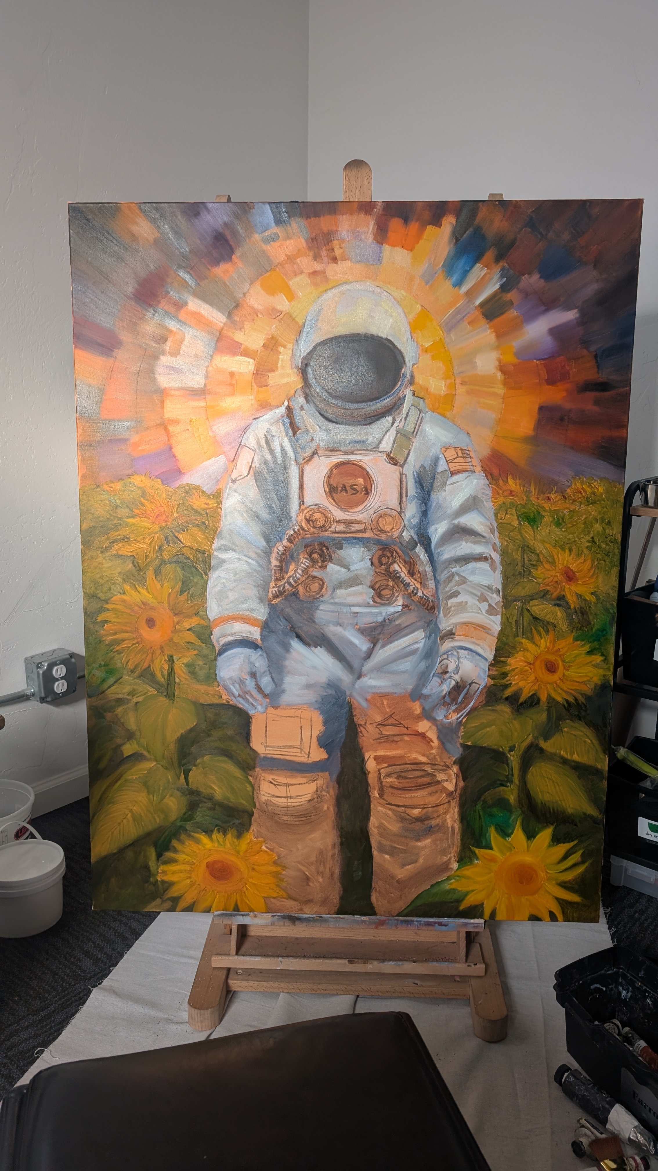 A painting of an astronaut in a sunflower field with a colorful sunburst behind them.