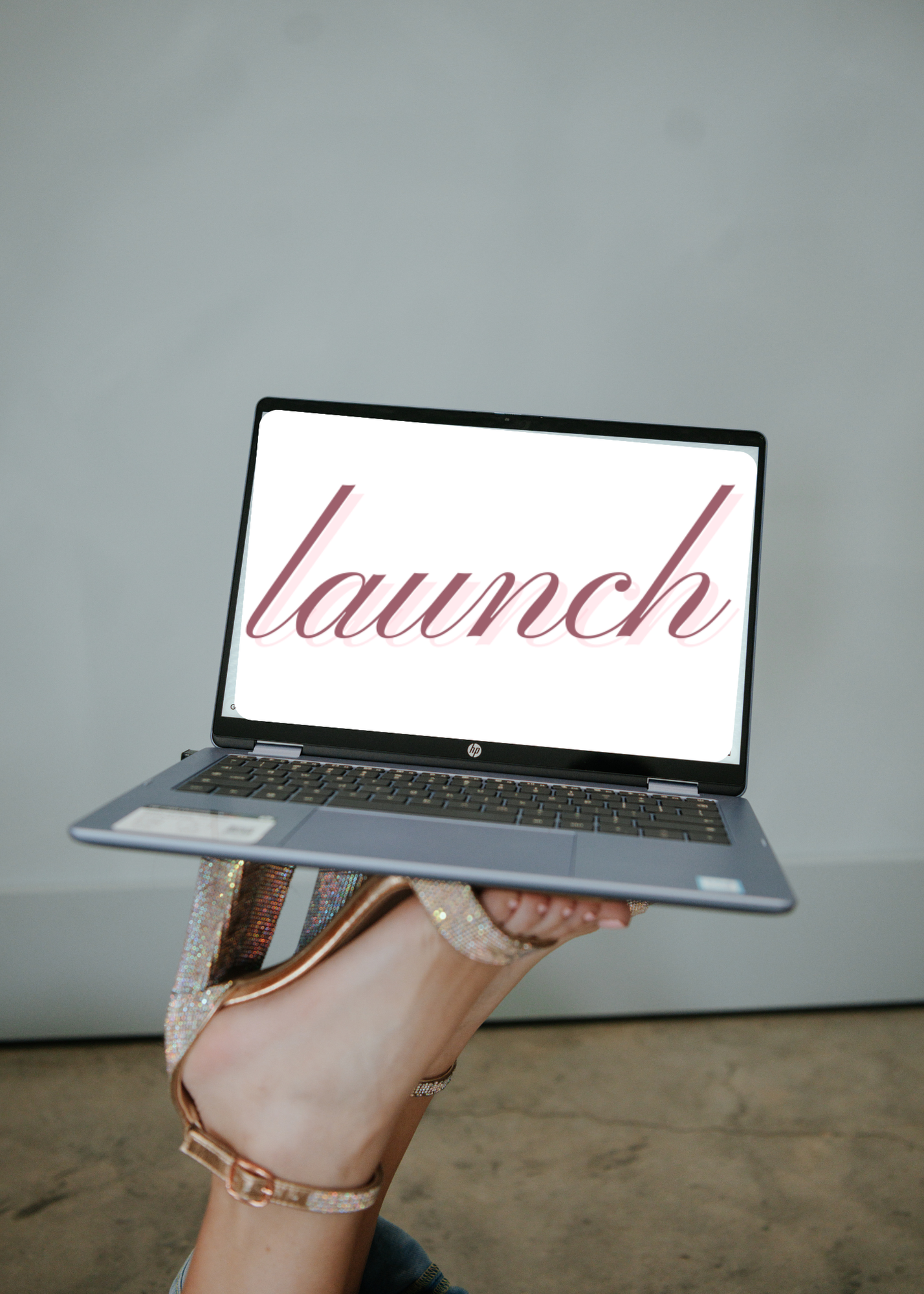 A black background with the word 'launch' written in pink cursive font.