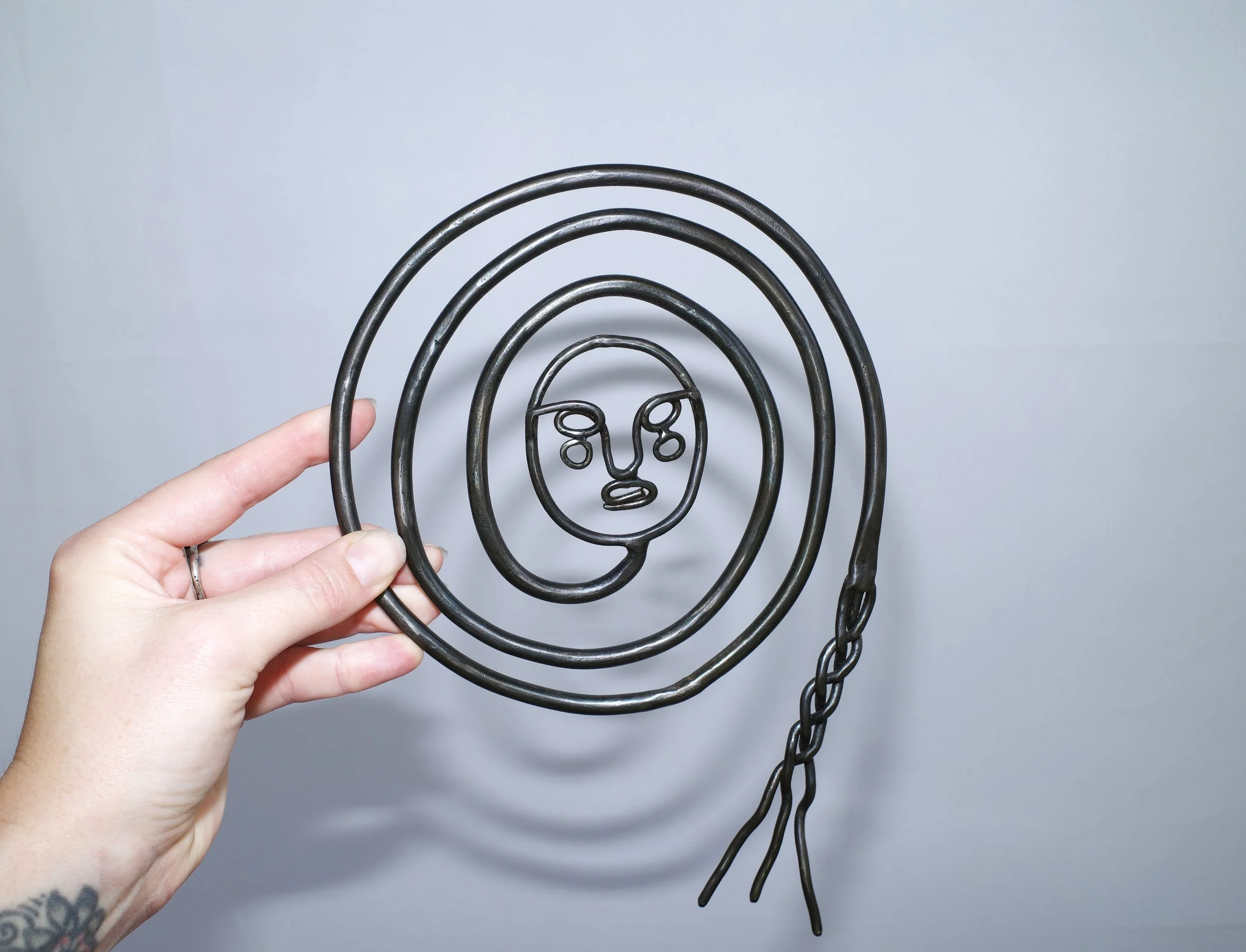 Spiral Head Charm.jpg