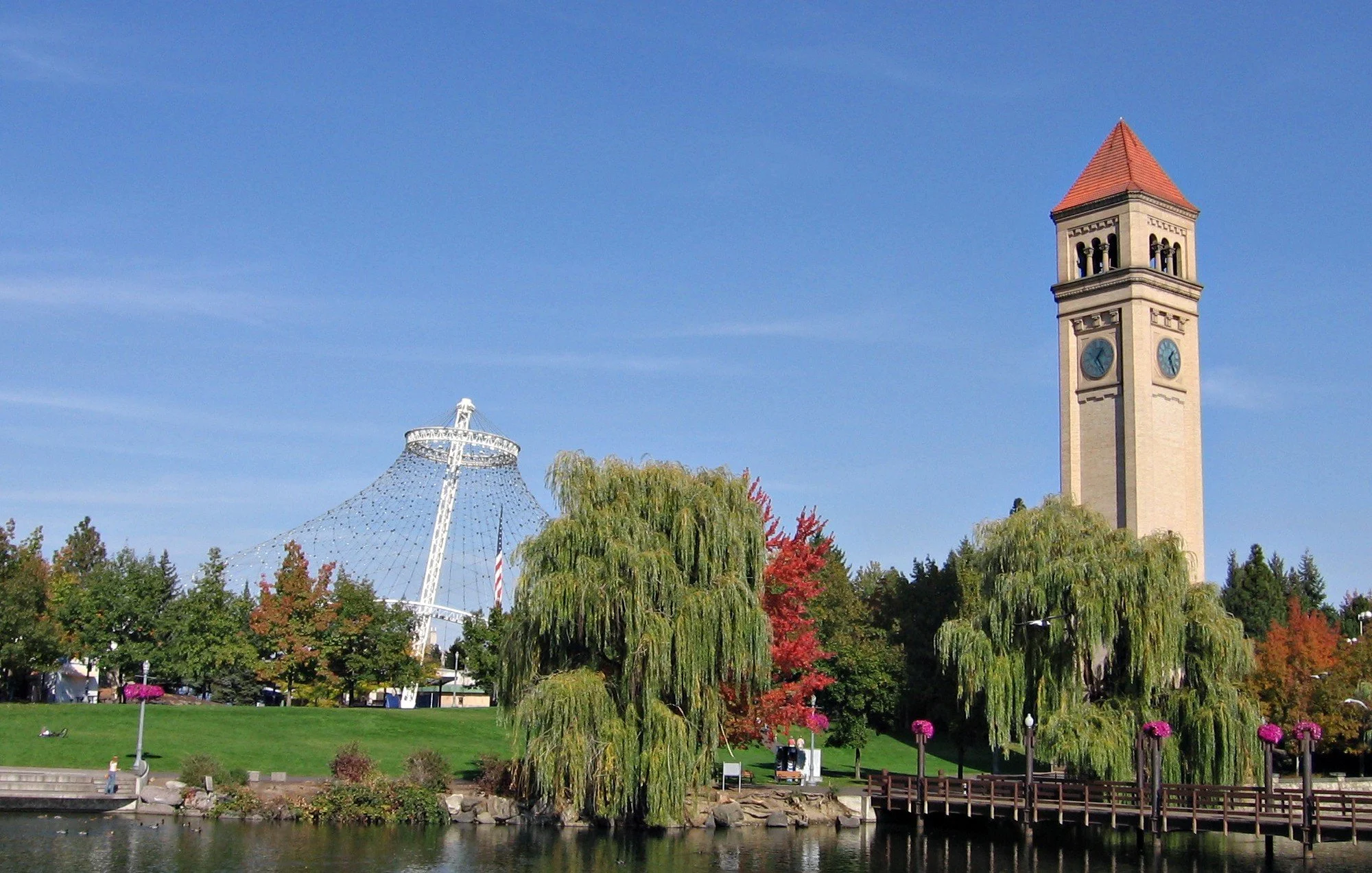 Image by Mark Wagner - A river flowing through a city park in summer