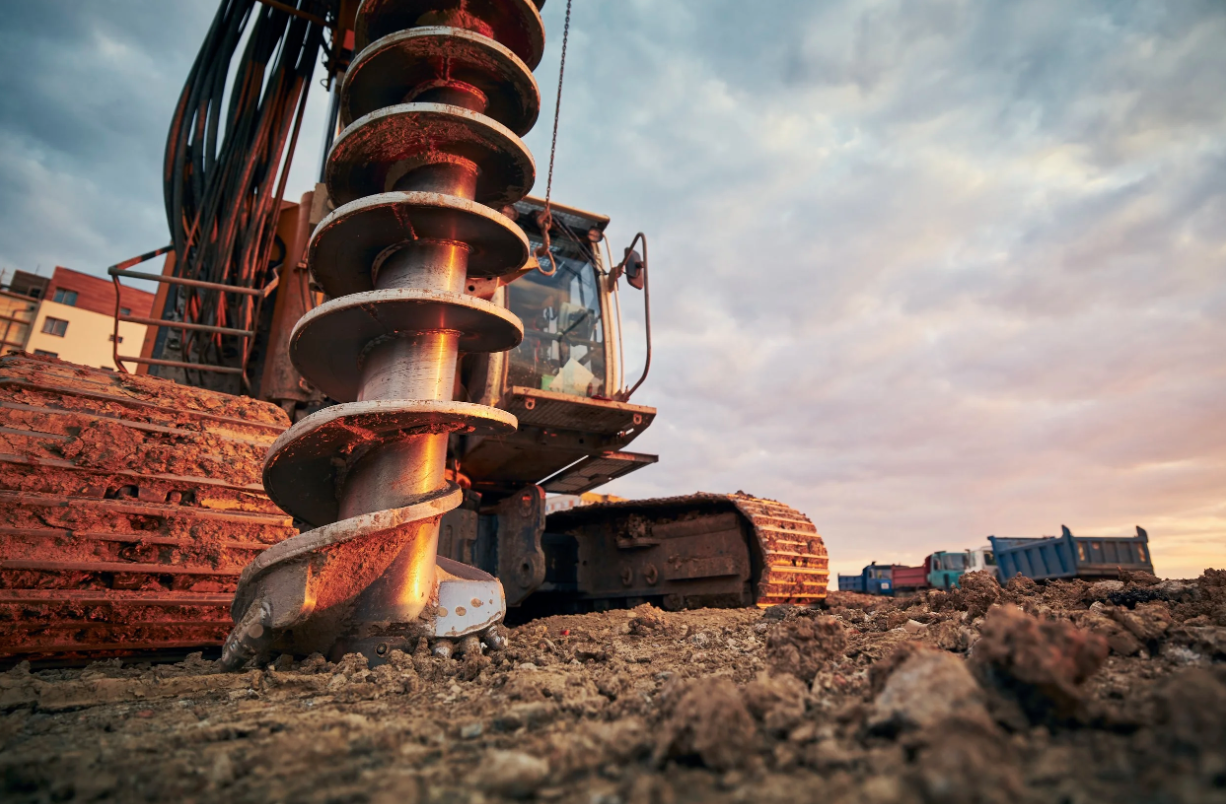 Construction auger performing drilling and subsurface work for a geotechnical project.