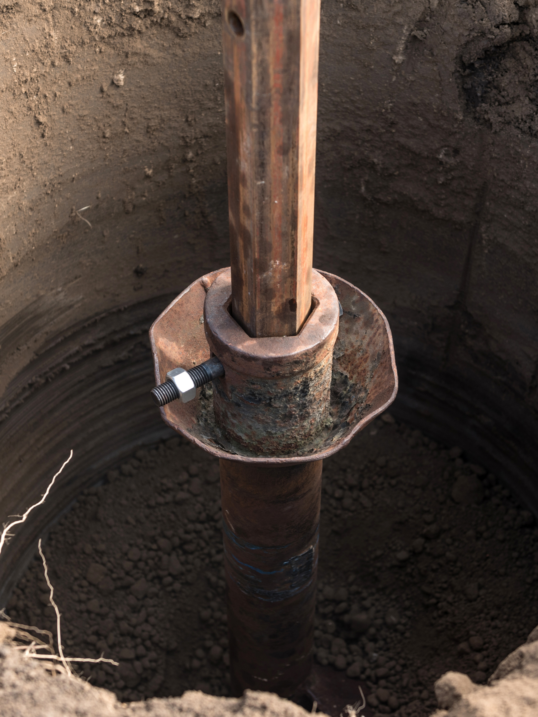 Geotechnical field testing equipment installed in soil for subsurface evaluation.