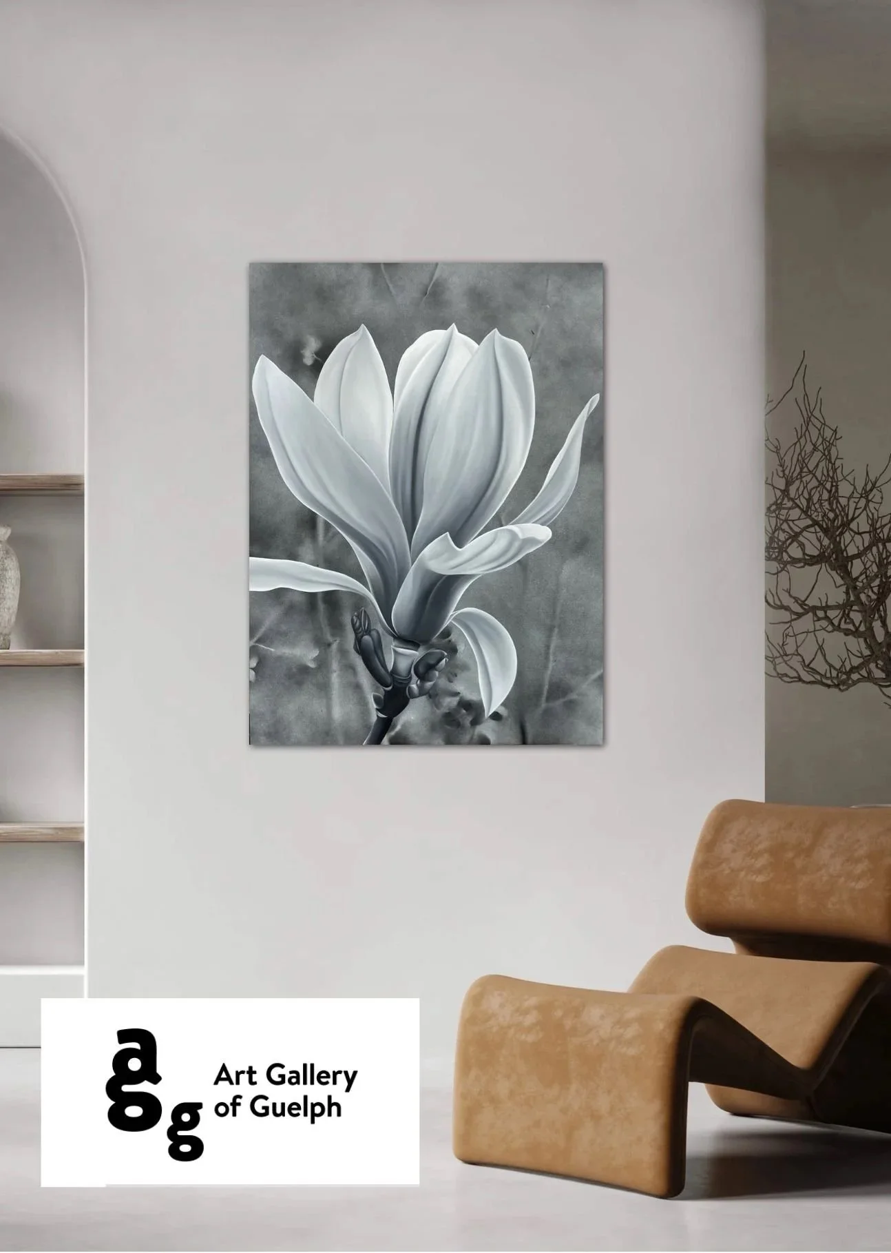 Black and white photograph of a magnolia flower on display in an art gallery.