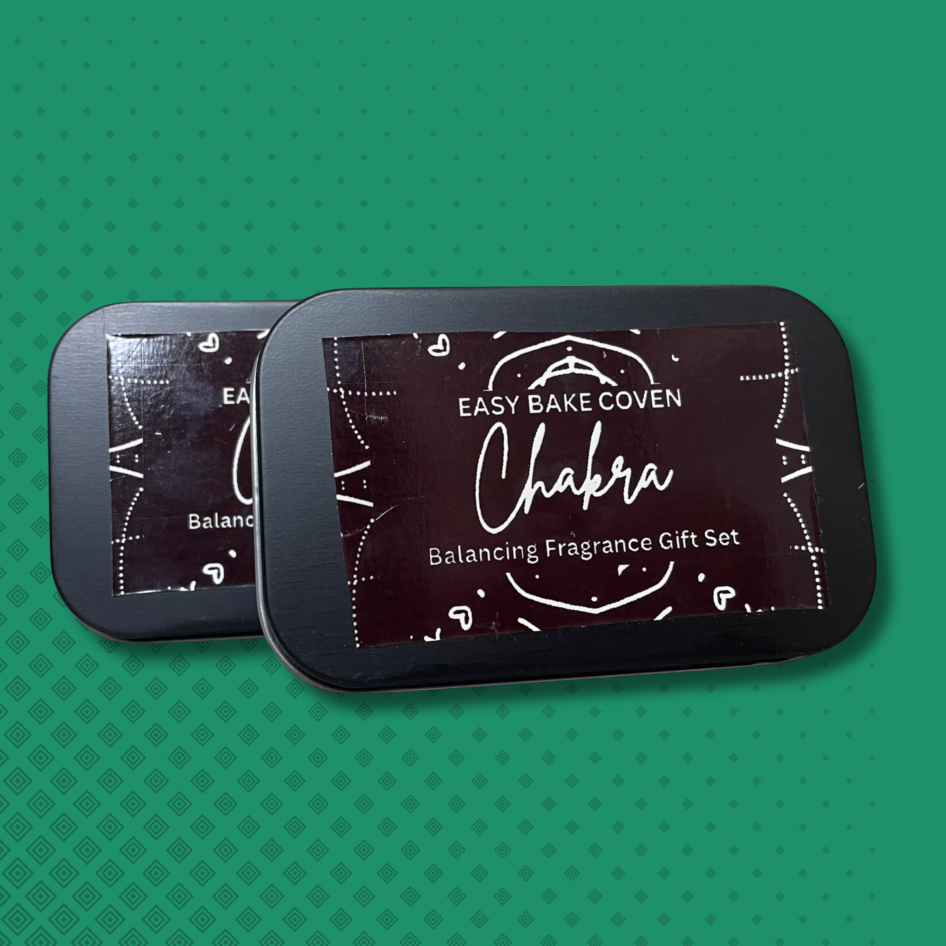 perfume sample tin on teal background