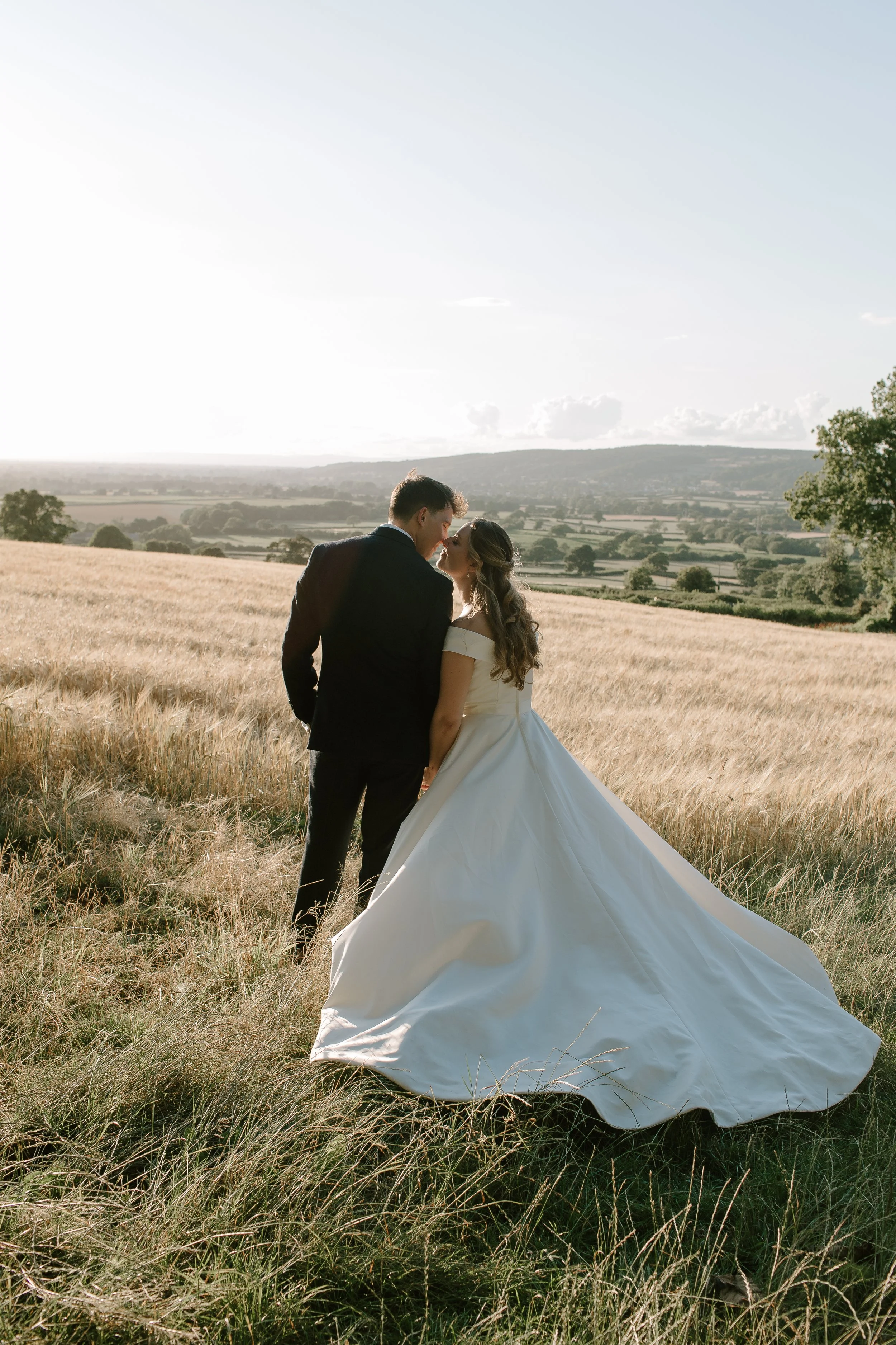 Coombe Lodge wedding photography in Somerset capturing an intimate sunset portrait of a bride and groom in the countryside.