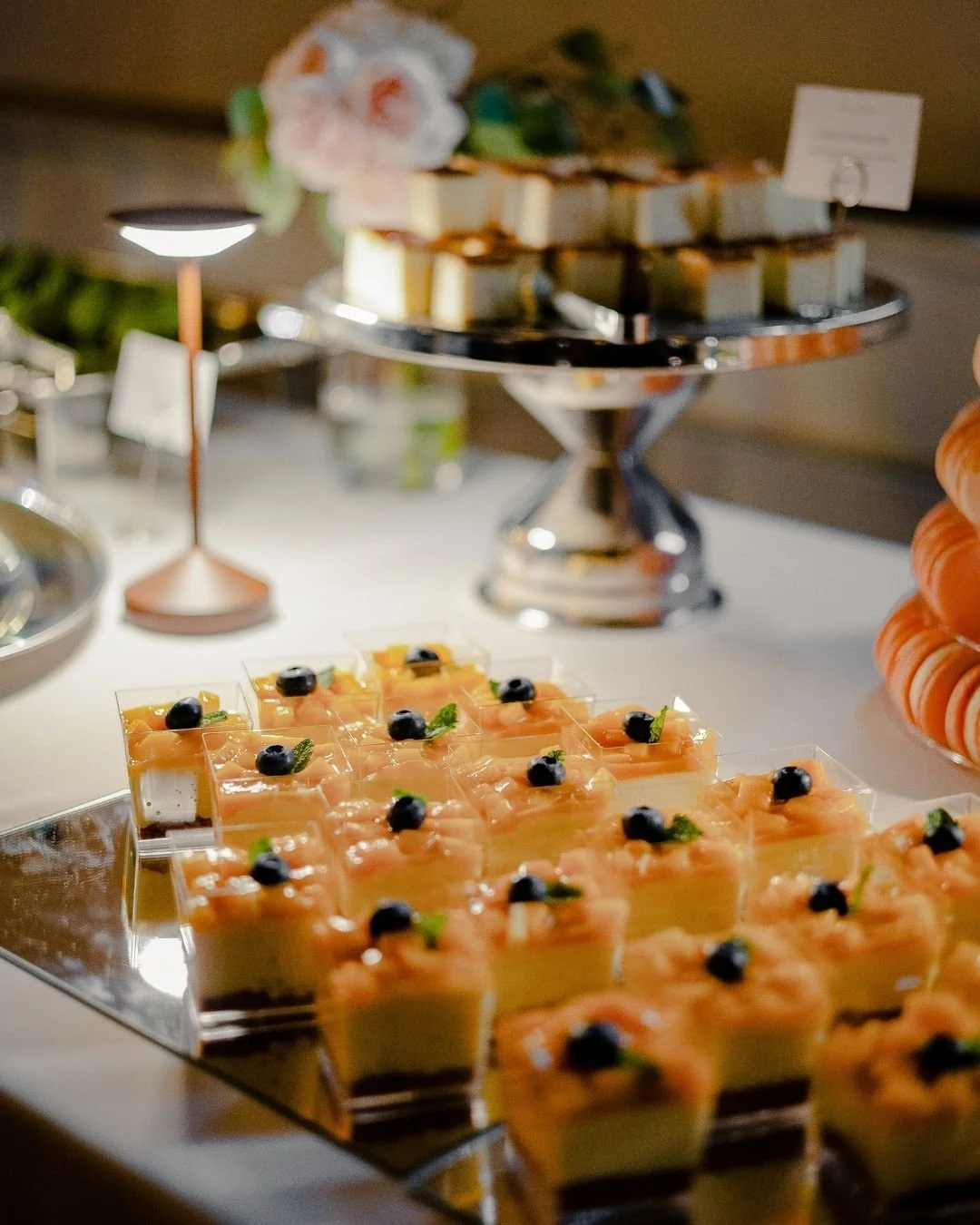 Mango mousse cups with blueberries displayed on WOW Bakery’s wedding dessert table in Calgary